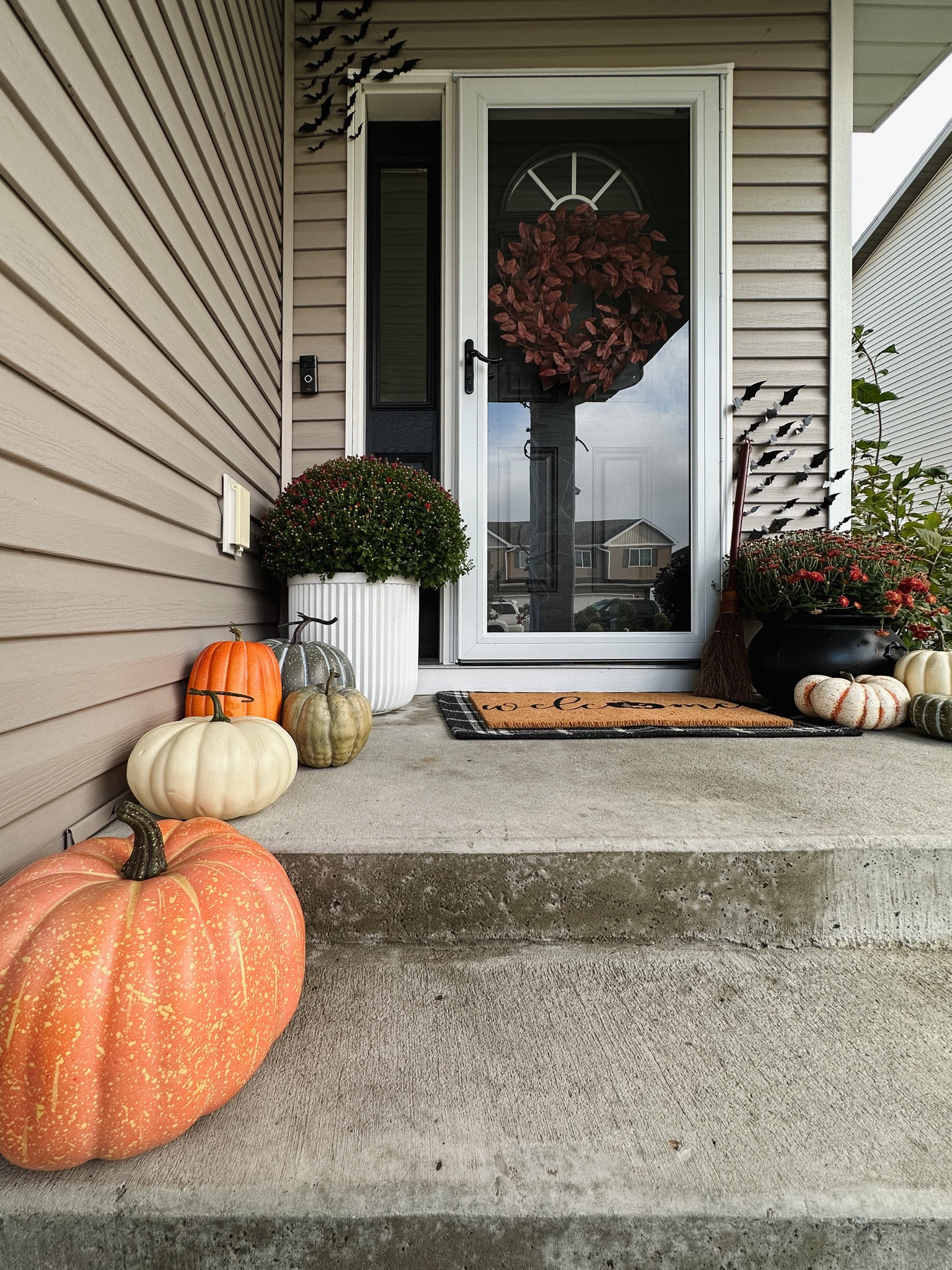Fall front porch, halloween front porch decor, burgundy fall wreath, black front door, faux pumpkins, halloween doormat, studio McGee doormat, witches cauldron, Amazon home, bats, home decor, michaels decor, mums

#LTKSeasonal #LTKhome #LTKHalloween