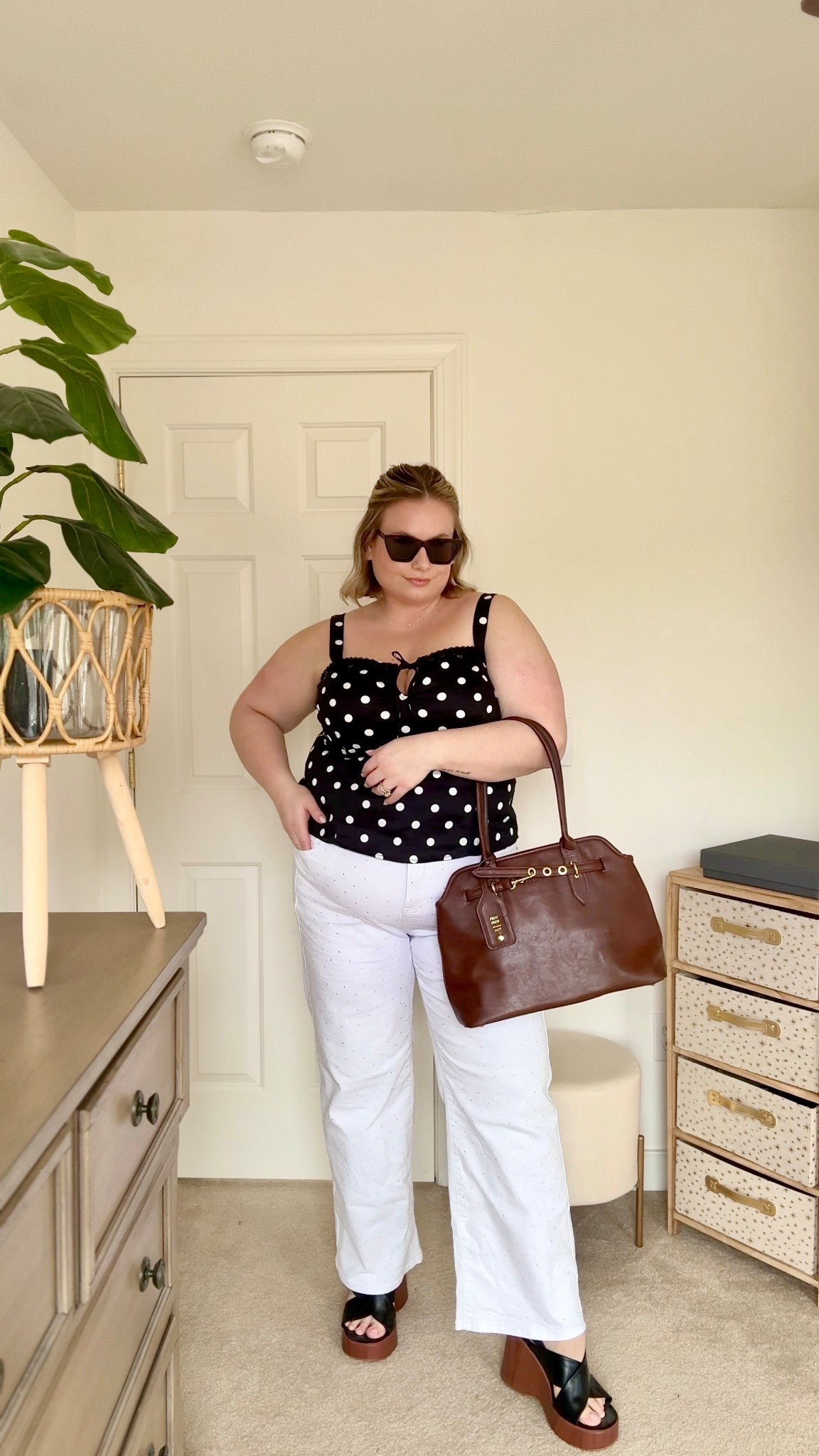 A little polka dot moment with white denim 🤍 This look feels so fun and timless - a plus size polka dot tank paired with @Torrid studded white jeans, finished with brown leather accessories and platform sandals. I’m wearing an 18 in the jeans and a 2x in the top! 

plus size spring outfit • polka dot outfit • white denim outfit • Torrid outfit • curvy fashion • white jeans styling • classic spring outfit

#LTKPlusSize #LTKdayinmylife #LTKSeasonal