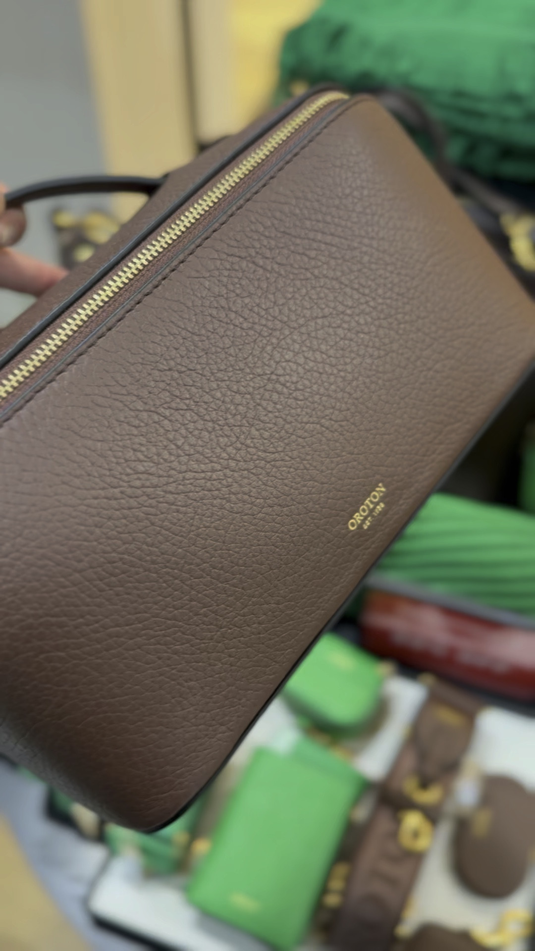 Love this Oroton cosmetic bag. But which colour ?? The brown is on sale! 