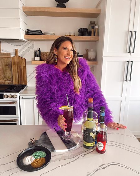 In a small purple shaggy faux fur coat, small tee underneath, size 28 jeans & Mardi Gras earrings for spring from Amazon - all fits TTS.

#LTKunder50 #LTKstyletip #LTKSeasonal