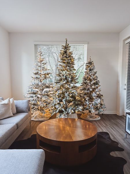 { my favorite time of year 🌲🌲🌲 i’m considering leaving this trio of @kingofchristmas flocked Christmas trees undecorated this year ✨ what do you think? either way, i love the forest feel of multiple Christmas trees together // shop the photo in my link in bio #flockedchristmastree #christmasdecor #kingofchristmas #christmastrees #christmashome } 

#LTKSeasonal #LTKhome #LTKHolidaySale