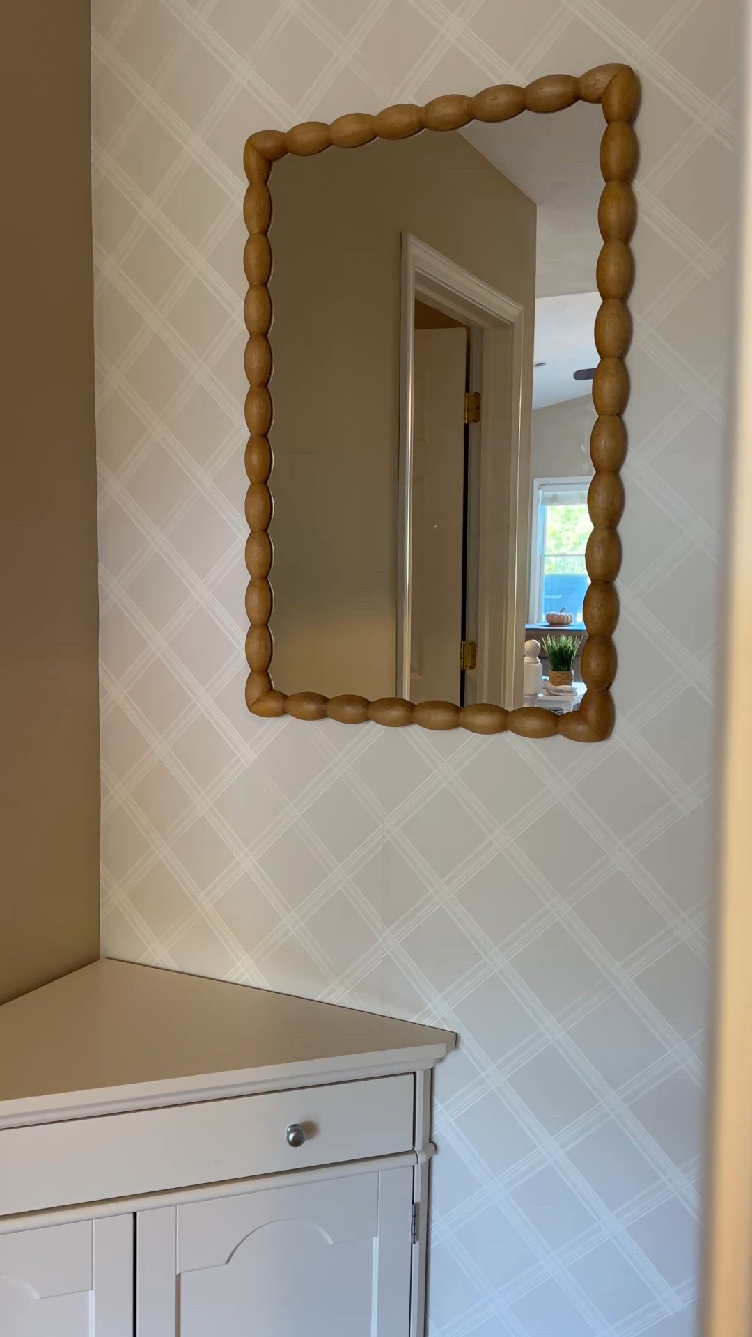 The prettiest medium wood tone mirror from Target 

#LTKHome