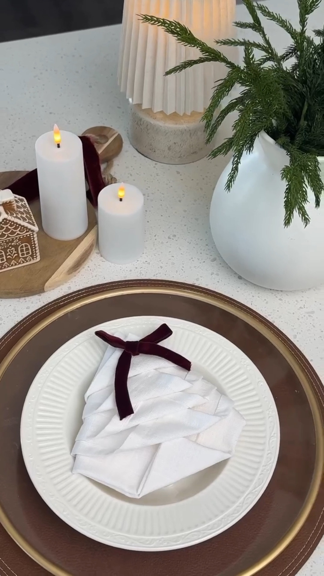How to fold your napkins like a pro for Christmas ✨ This Christmas tree napkin fold is such an easy way to make your table look elevated, cozy, and put-together without buying anything extra. Perfect for hosting, Christmas dinner, or even a simple holiday brunch, it instantly makes your table feel festive and intentional. Once you try this fold, you’ll never go back 🤍 What’s your favorite napkin style so far?

@target napkins 
@hobbylobby mini gingerbread houses 

#christmasdecor #holidaydecor #homedecor #christmas #christmasdecorideas

#LTKHoliday #LTKHome