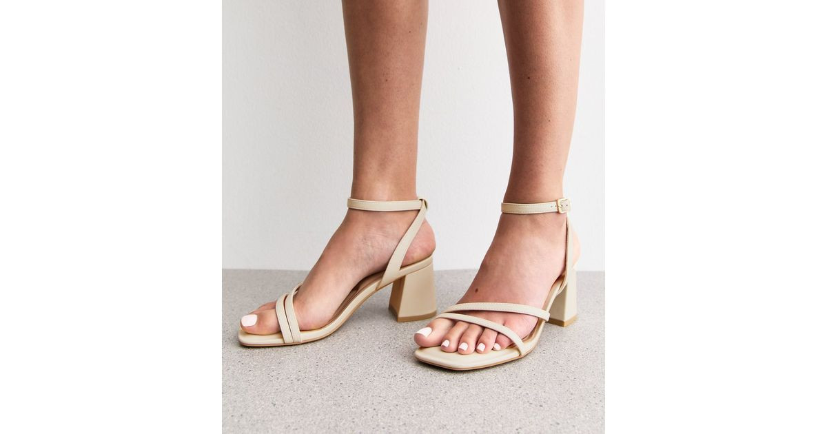 Wide Fit Off White Faux Leather Block Heel Sandals
						
						Add to Saved Items
						Remove f... | New Look (UK)