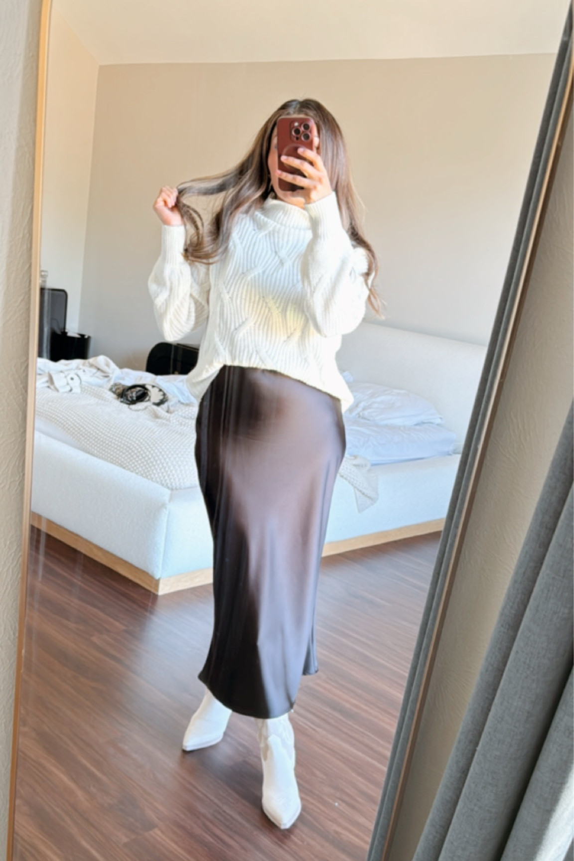 Sweater and satin skirts with cowboy bootss

#LTKU