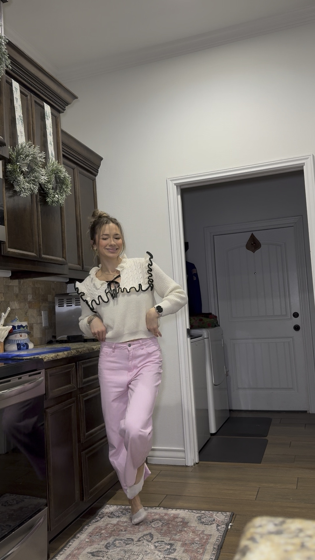 Pink wide leg pants with white sweater with front bow tie 

#LTKStyleTip #LTKSaleAlert #LTKCyberWeek
