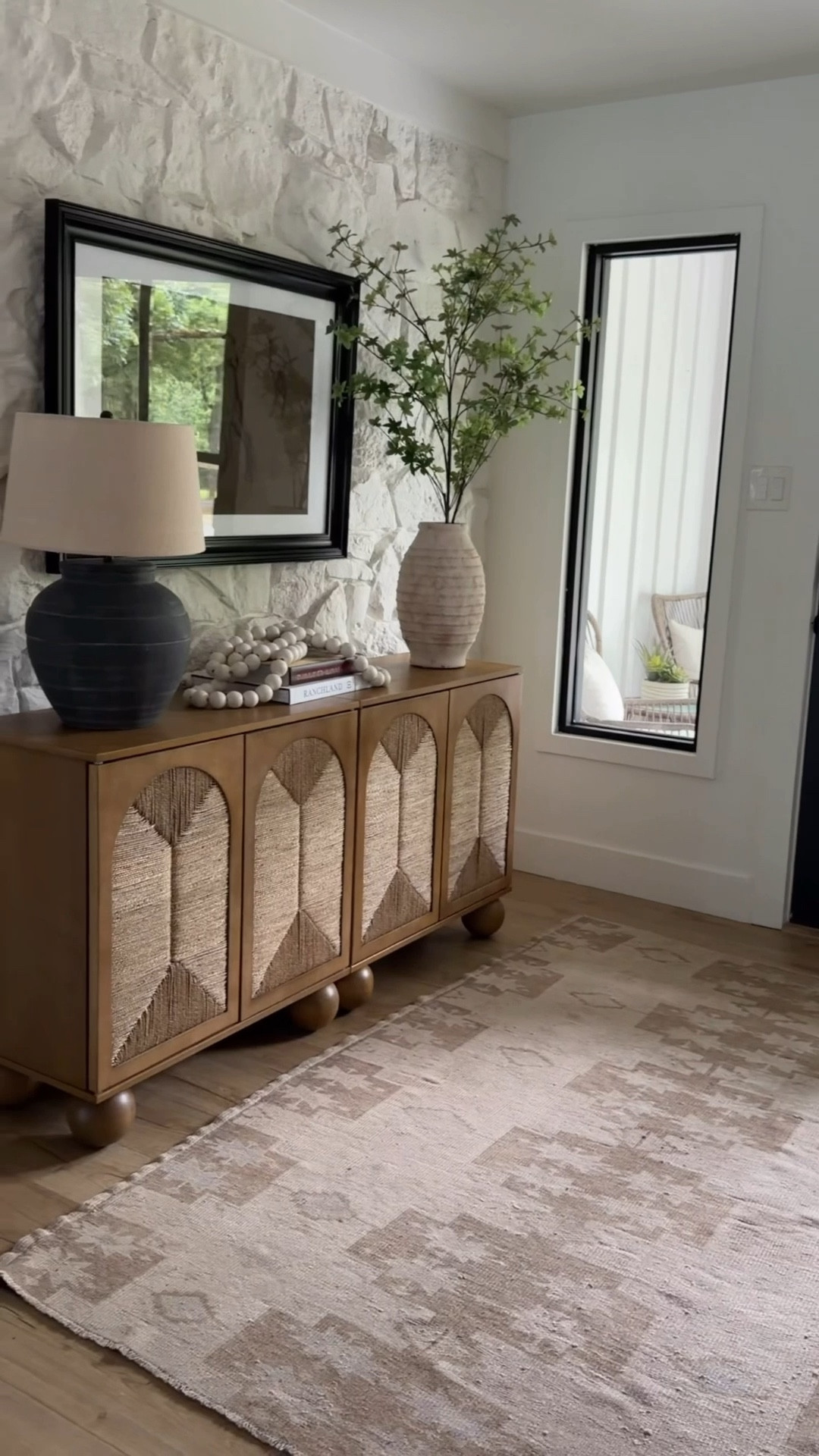 Entryway refresh with some of my favorite high/low finds 🤍 the Nathan James cabinet is such a standout piece—beautiful wood tone, great texture detail, and the quality for the price is so good. It’s the perfect mix of functional storage and statement design.

I layered in mostly Pottery Barn decor for that warm, collected look—vase, greenery, beads, and artwork to keep everything feeling soft, neutral, and inviting. This is one of those spaces that sets the tone for the whole home the second you walk in.

Keywords: entryway decor, entryway styling ideas, console cabinet, storage cabinet, Nathan James furniture, affordable furniture finds, pottery barn decor, neutral home decor, modern organic entryway, foyer styling, textured furniture, wood cabinet, home styling inspiration, entryway refresh @Nathan James 

#LTKMothersDay #LTKSeasonal #LTKHome