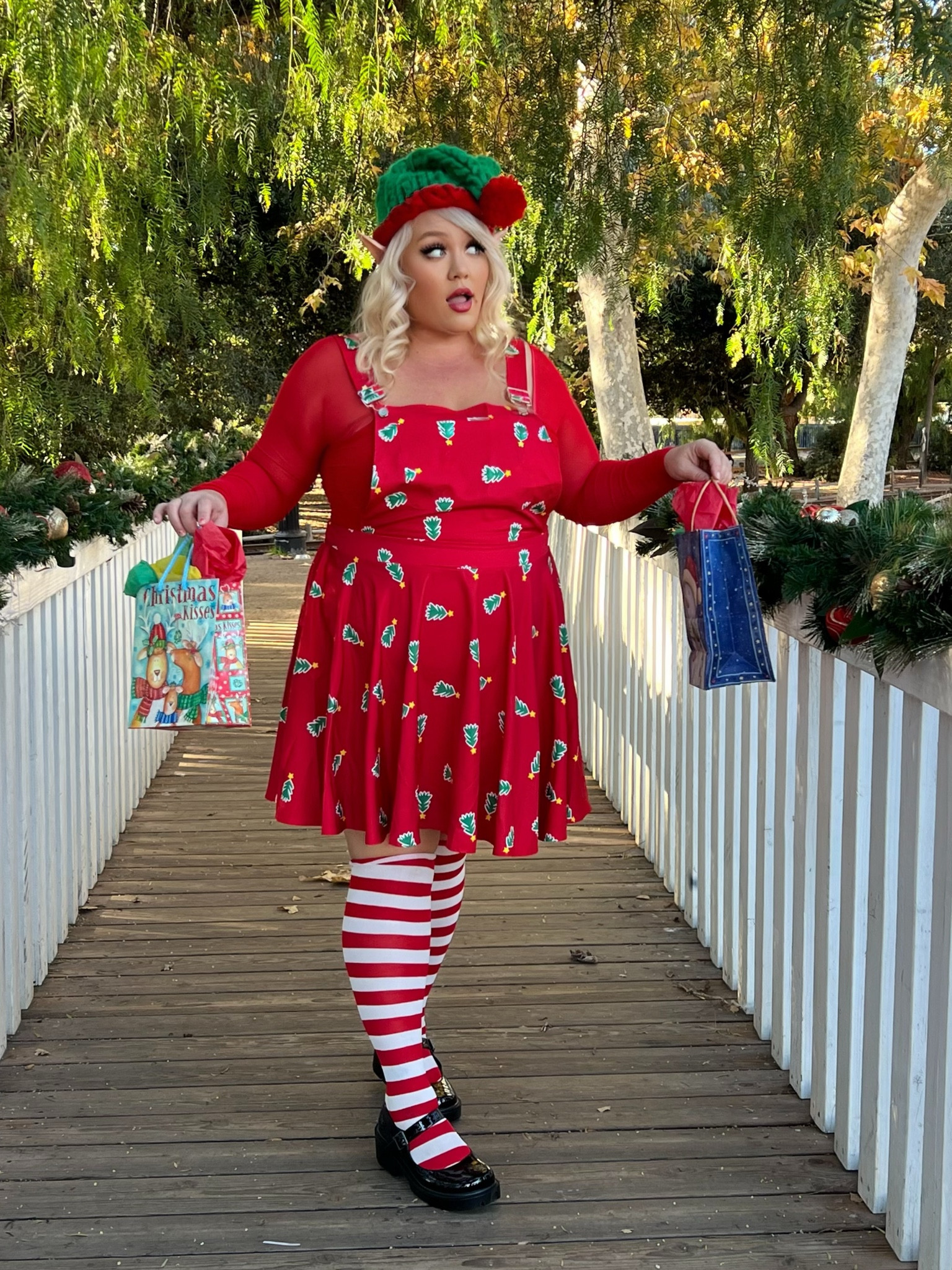 Elves at work! 
tree red and green overalls dress
red long sleeve body suit
pepperminy knee highs
black mary janes
elf ears

#LTKHoliday #LTKPlusSize #LTKMidsize