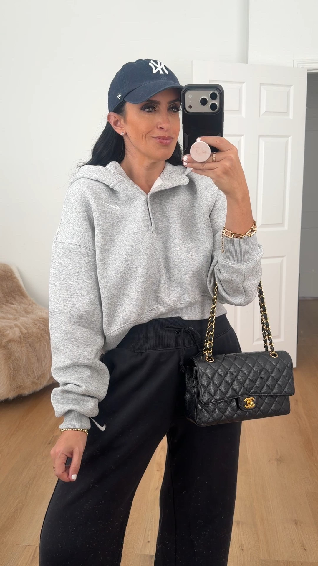 Nike Sportswear Phoenix Fleece Women's Oversized Cropped Henley Hoodie wearing size medium. 