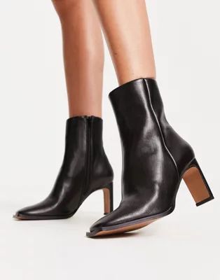 ASOS DESIGN Remmy set-back heeled boots in black | ASOS (Global)