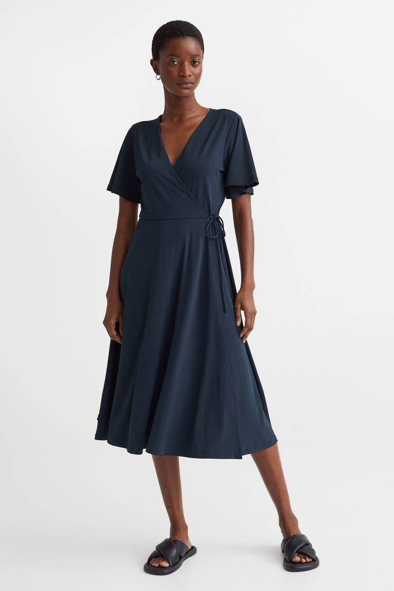 Conscious choice  Calf-length dress in gently draped jersey. V-neck at front with sewn wrapover, ... | H&M (US + CA)