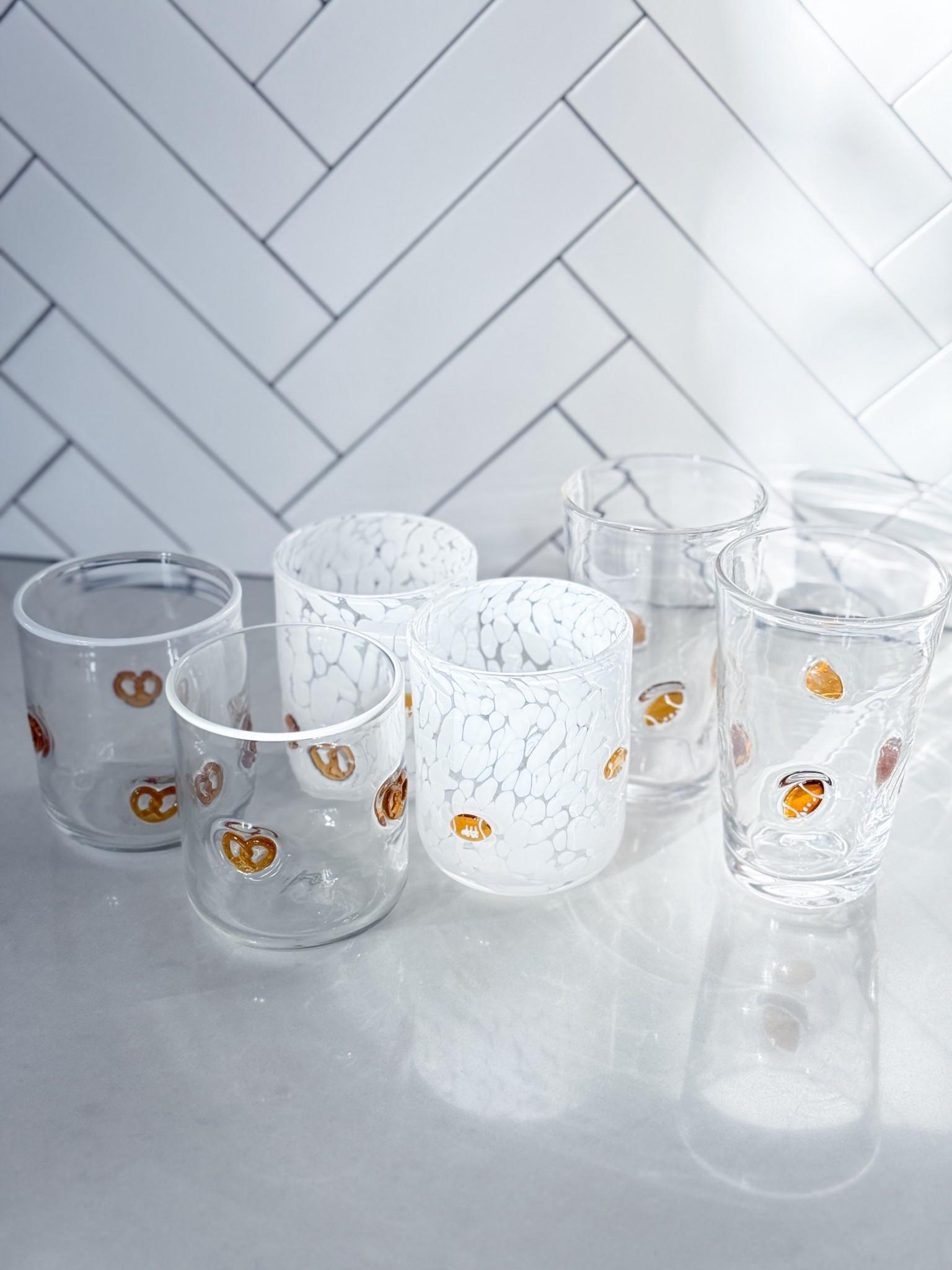 Fall game days just got cuter. I’m fully embracing football season with our new icon glasses. They’re the perfect mix of playful & pretty, & I’ll be using them all season long for cider, cocktails, mocktails, you name it. Linking them on LTK because these go fast every year!

fall glassware - football drinkware - pretzel cup - handblown tumbler - football season party - game day entertaining - aesthetic fall decor - neutral fall kitchen - fall hosting essentials - football party glassware - cozy fall kitchen finds - unique drinking glasses - glassware with icons - football cup set - cute fall kitchen finds

#LTKParties #LTKFamily #LTKHome