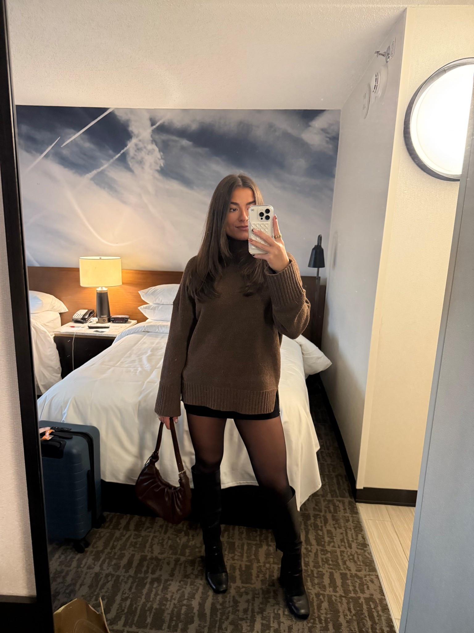 Fall/winter date night outfit - brown turtleneck sweater with a black mini skirt tights & boots!

#LTKBeauty #LTKSeasonal #LTKStyleTip