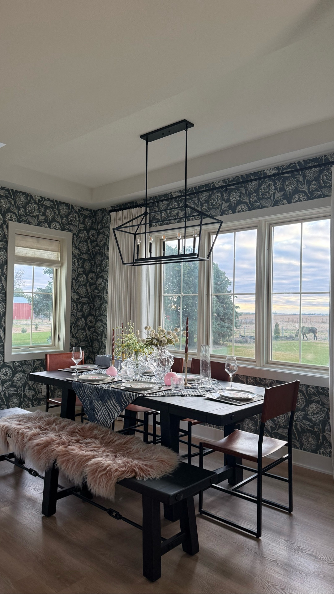 Last minute table setting tips:

1. Throw on a base fabric/table cloth.
2. Add some place mats with pattern.
3. Just grab some pretty paper napkins.
4. Add your plates, glasses, and utensils.
5. The important part to make it look really good is the center piece.  I added two pretty vases and a lot of candles to light.

#tablescape #eastertable #diningroomtable #wallpaper

#LTKHome