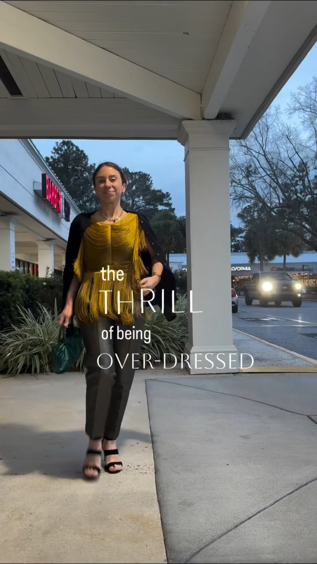 The top fits more snug than I expected! I am in an XS and am usually a size 2 or 0. Do *not* size down. True to size! 

For a 5 PM dinner in a strip mall… Here, I sported a chartreuse tasseled gladiator vested top (🧐) over disco ball sparkled cuffed, pleated and creased trousers (🤓), with an emerald satin evening bag and wool cardigan. 

For…. A 5 PM dinner date in a restaurant next to the grocery store on a week day. 

It was actually a fabulous date with my husband at our favorite locals restaurant, where I had a perfect crisp rosé with the most delicious baked salmon I’ve ever tried. Ever! I was so glad to be dolled up for what was to me a very special and festive two hours out!

Gotta get those thrills where you can! For me, getting gussied up for rather average experiences has not only put a pep on my step, but it’s become somewhat a of an inside joke among me, myself, and I. I sincerely smile and giggle at myself to see how far I can take it. 

Top @karen_millen 
Trousers @reiss 
Sandals @anntaylor 
Bag @prada 
Necklace @janewin_jewelry 
Cardigan @brooksbrothers