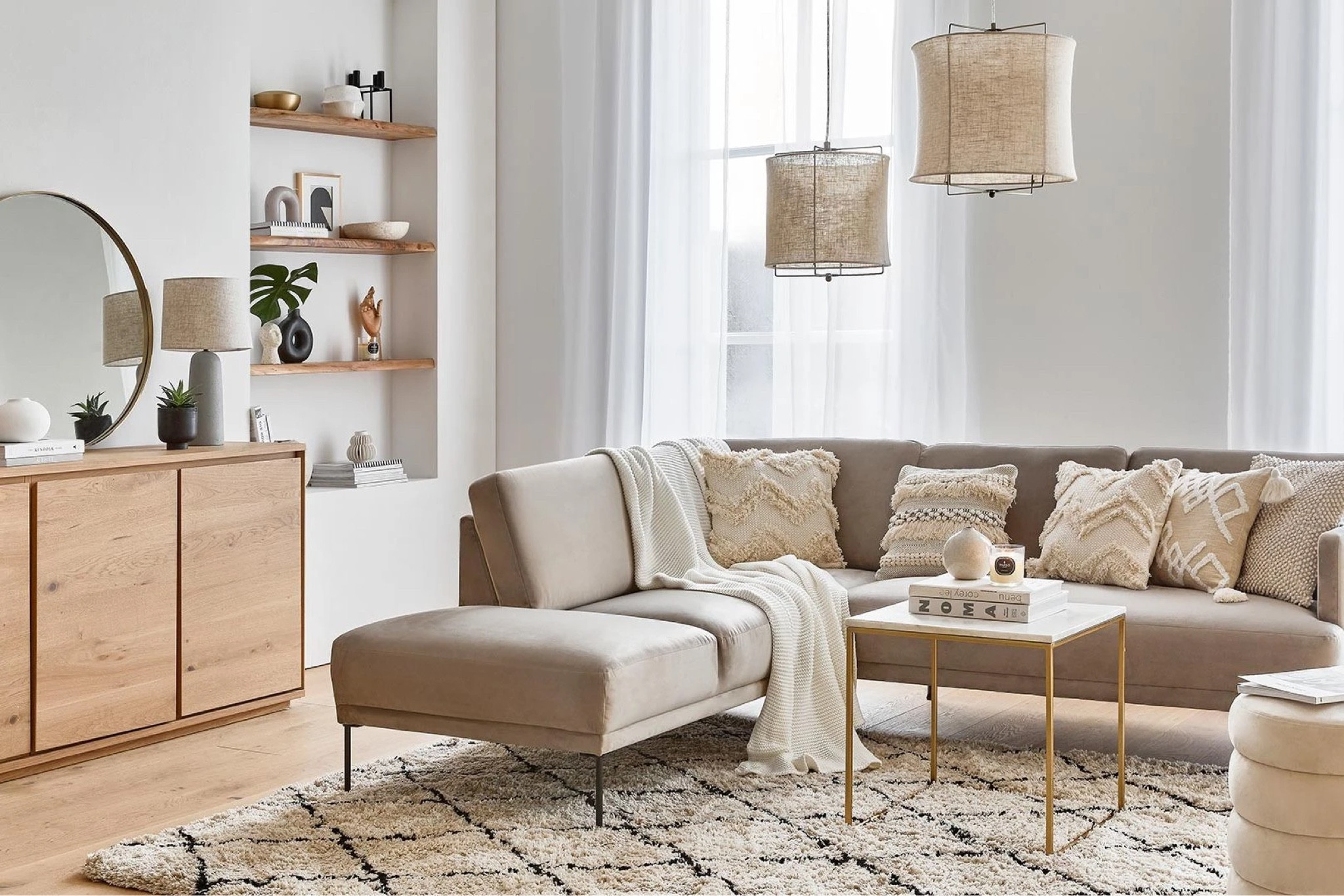 Living room essentials include a Minimalistic couch, marble top table, coat blankets, table top books, decorative plants. Parisian styled home, how to style your apartment like a Parisian, how to decorate like a Parisian #westwing WestwingNow Westwing Collection

#LTKhome #LTKeurope #LTKCyberweek
