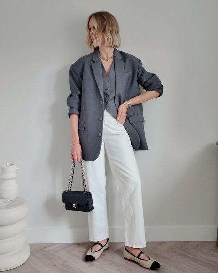 Grey oversized blazer The Frankie Shop Gelso
Grey waistcoat also Gelso Frankie Shop
Agolde white criss cross jeans
Vintage Chanel handbag classic flap small 
VIVAIA Tamia Mary Janes in two tone - 10% off 10CB 

Smart casual blazer outfit workwear chic 

#ltkworkwear #ltkunder100 #ltkshoecrush

