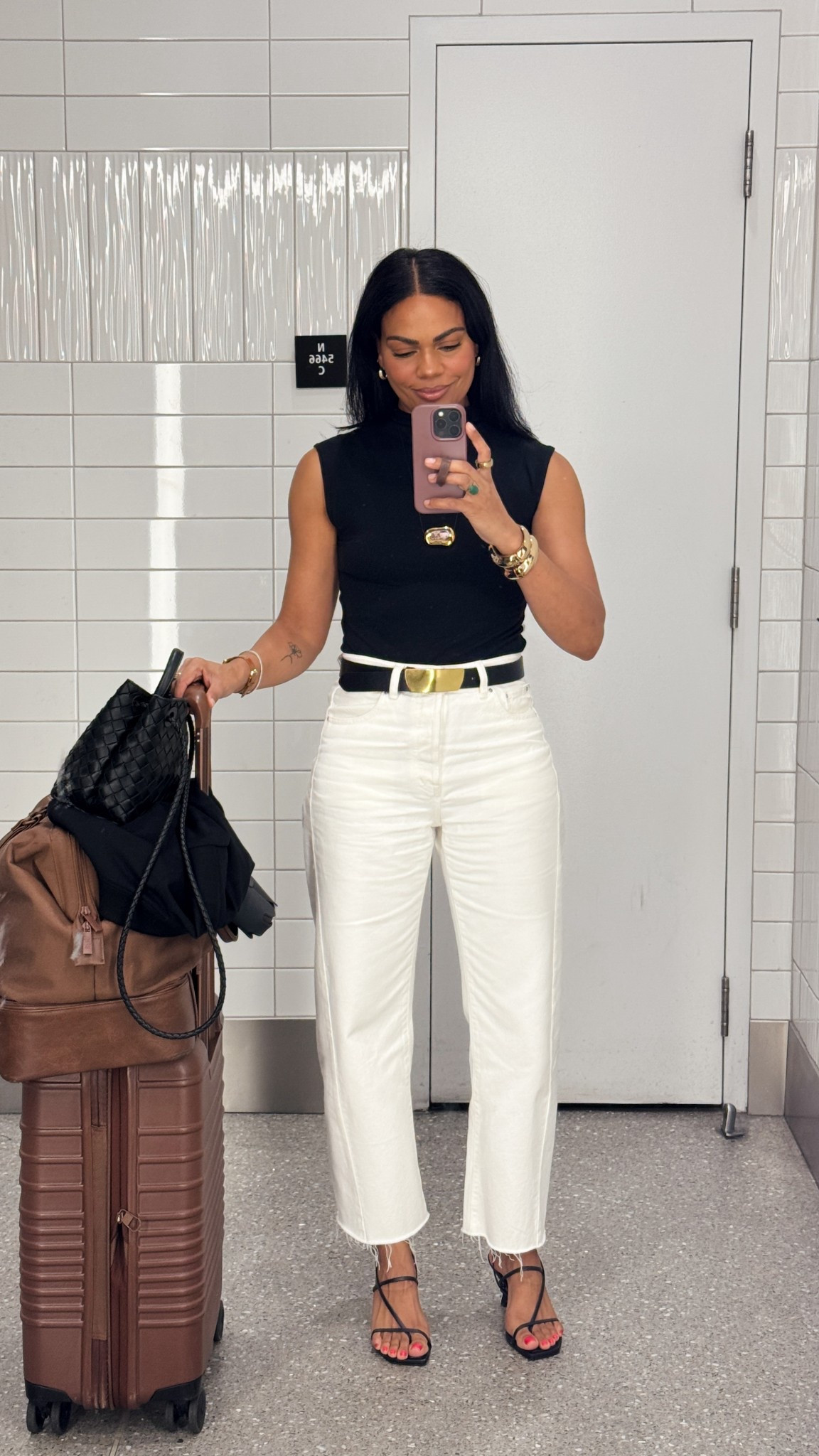 Airport outfit to Tokyo: white barrel jeans, mockneck top, gold hardware necklace, gold hardware black belt, black heels, beis carry on & weekender bag. Everything is tts. 


#LTKTravel #LTKStyleTip #LTKOver40