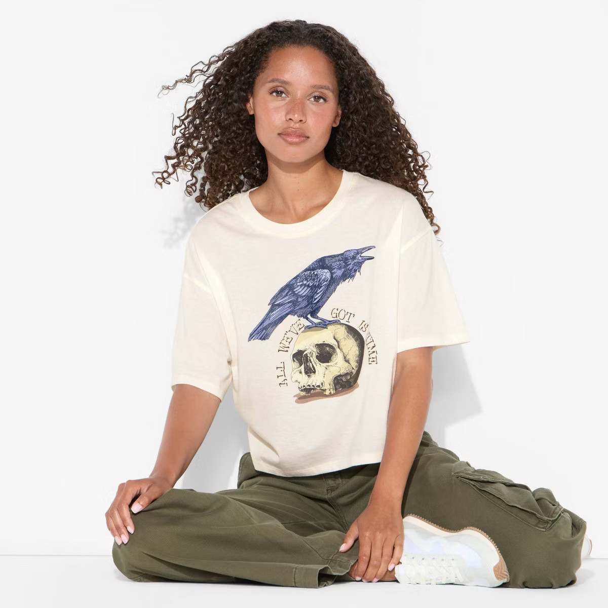 Women's Raven Boxy Cropped Short Sleeve Graphic T-Shirt - Off-White | Target