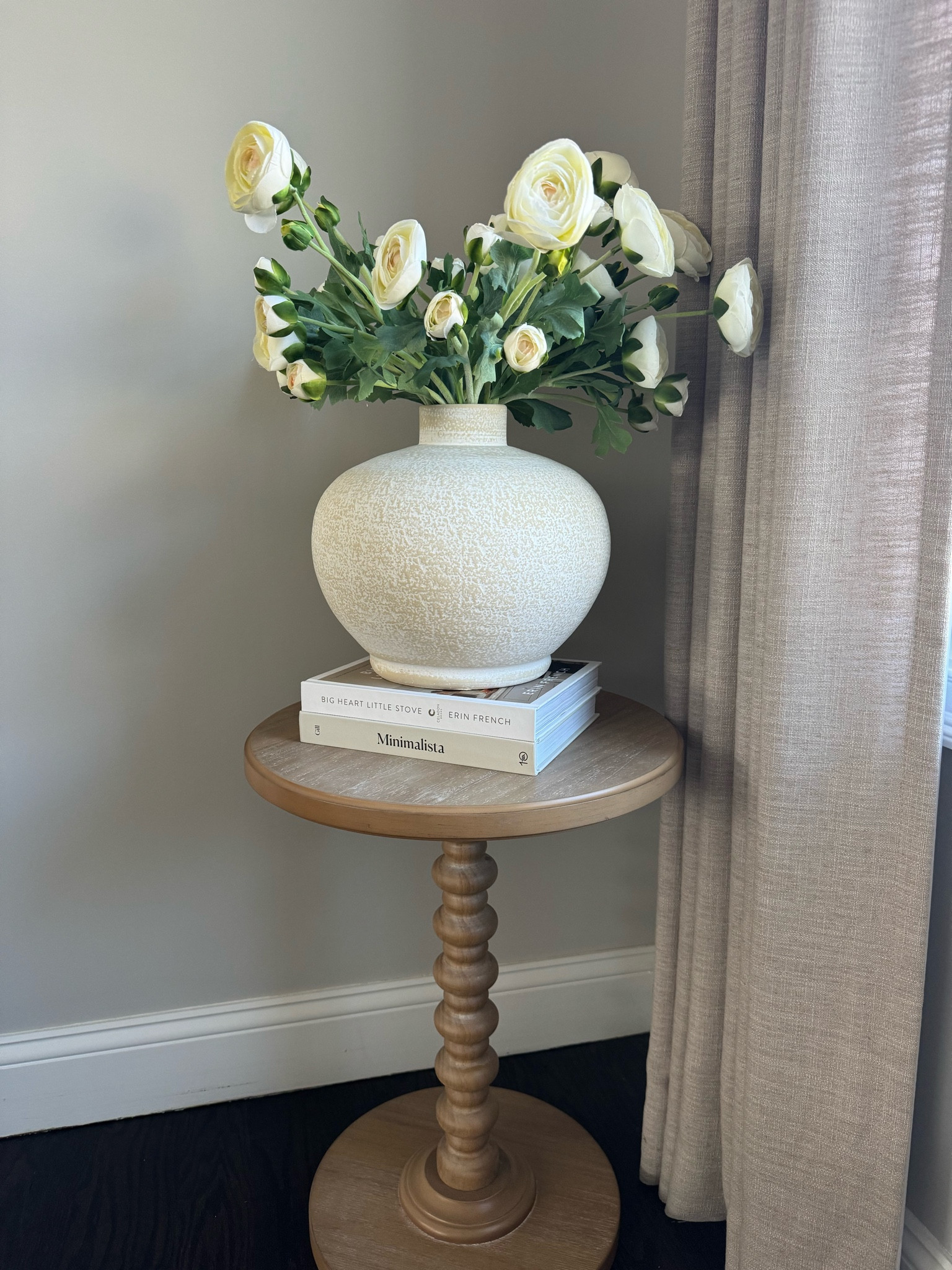Wood corner table styling! 

These faux ranunculus flower stems come in packs of three stems. I used nine stems total, so I purchased three sets to fill this vase.

The cream color, ceramic vase comes in a few other sizes, which I will attach as well.


#LTKhome #LTKSeasonal #LTKfindsunder50