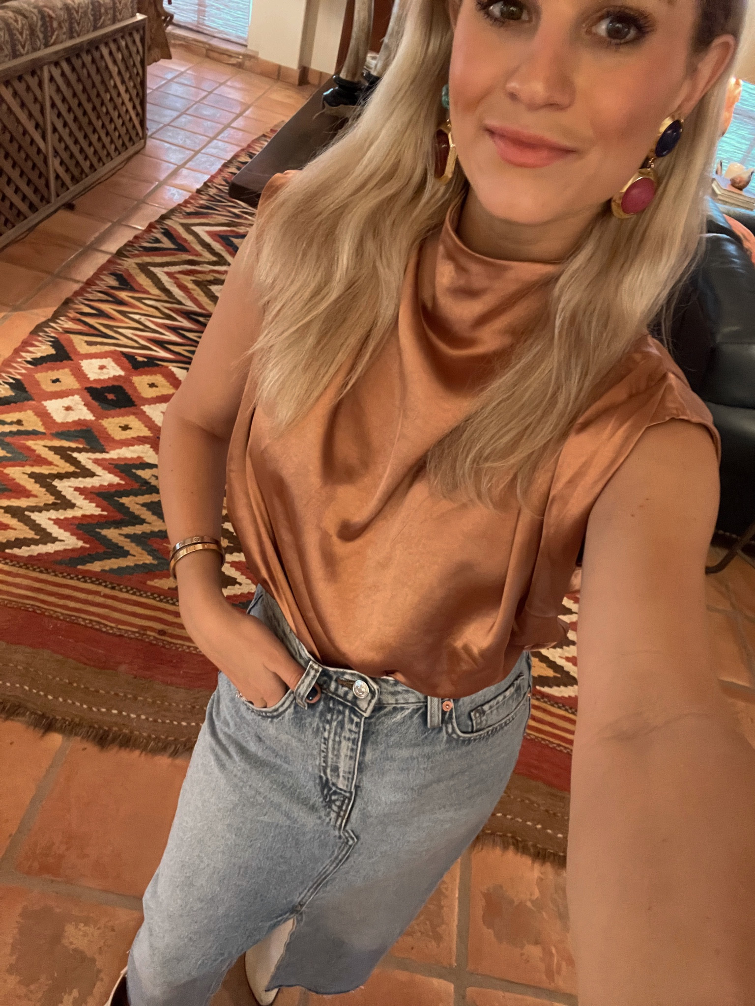 Loving the long Jean skirt comeback. Paired it with a satin bronze cowl neck top and cowboy booties to make it ranchy. Get the top and skirt on sale now!

#LTKHoliday #LTKstyletip #LTKunder100