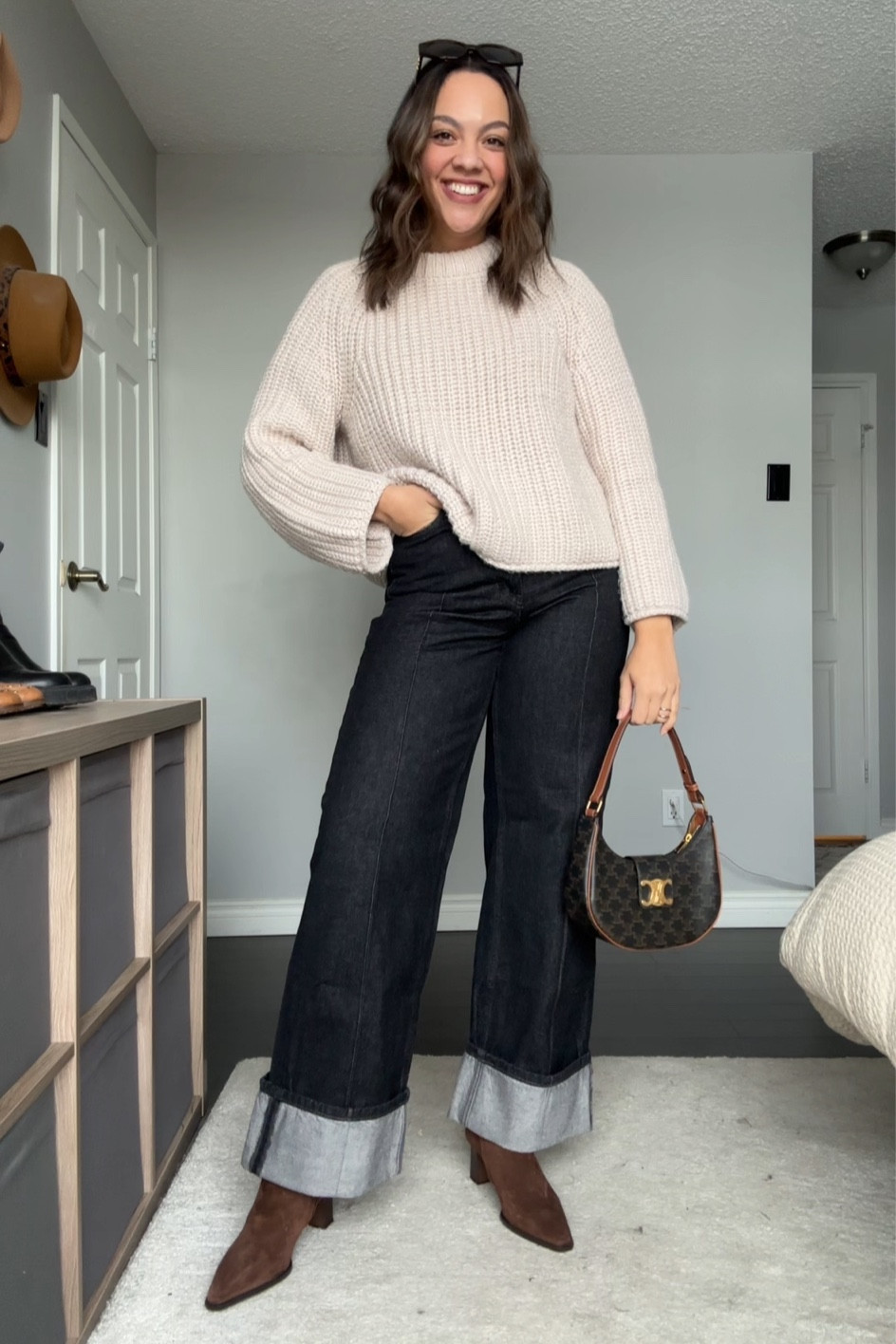 Winter outfit inspiration! Details below:
-Banana Republic black wide leg cuffed jeans, I have a size 30 long. 
-Brown suede ankle boots, similar linked. 
-H&M beige knit crewneck sweater, I have a medium. 
-Celine Triomphe sunglasses. 
-Celine Triomphe Ava bag in canvas. 


#LTKstyletip #LTKSeasonal #LTKfindsunder100
