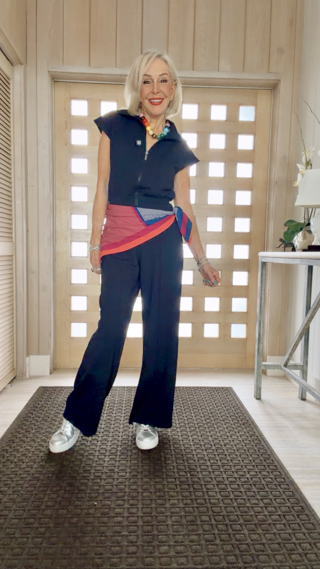 Keller navy jumpsuit. 
Silver sneakers. Both by Saint and Sofia. My favorite British brand.
Also love this Prism Riyale Bubblegum beaded necklace. My own scarf

#LTKOver40 #LTKgrwm #LTKTravel