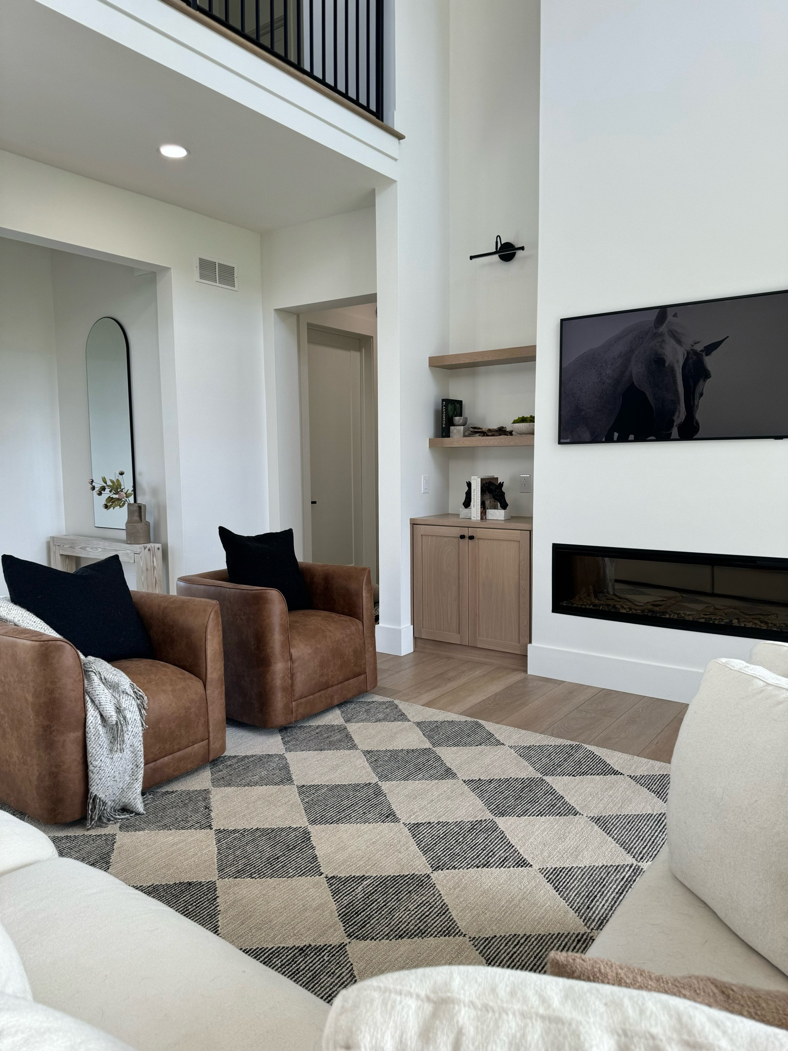 Living room refresh with this beautiful checkered rug that’s on sale right now! 🖤

#LTKfindsunder100 #LTKhome #LTKsalealert