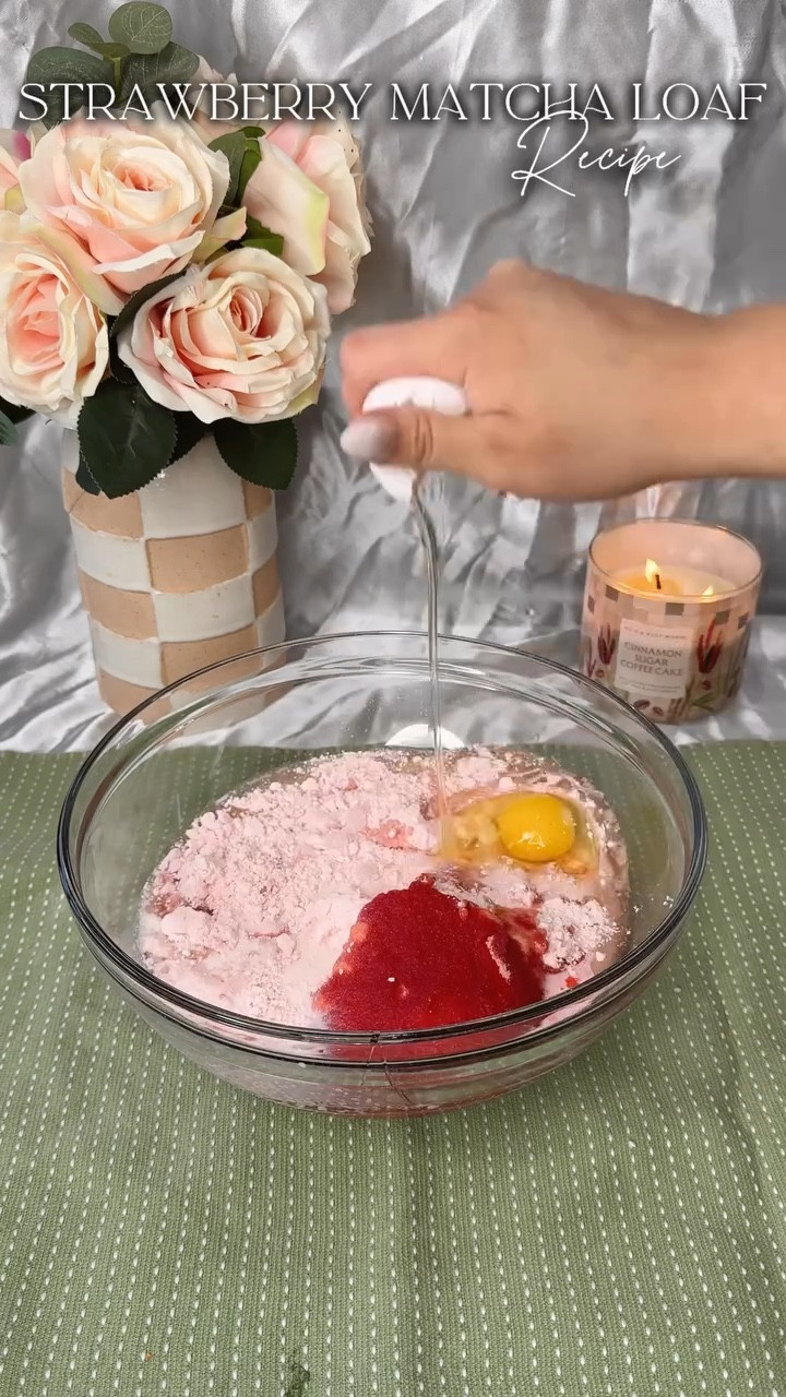 Starbucks has been coming out with crazy combos lately and somehow missing the mark. I know I could make a better version of their new strawberry matcha loaf that actually tastes like strawberries AND matcha. What should I make next?🍵🍓
.
Ingredients:
The Batter
*  1 box of strawberry cake mix
*  4 eggs
*  ½ cup of vegetable oil
*  1 cup of milk
*  1(3.40z) of strawberry pudding mix
*  ¼ cup of hot water
*  1 tablespoon of matcha powder, sifted
* The Icing -
*  ½ cup of white chocolate chips
*  2 tablespoons of whole milk
*  1 tablespoon of strawberry syrup
Instructions:
1.  Preheat the oven to 350F (180C). Grease a loaf pan with cooking spray. Set aside.
2.  In a large mixing bowl, combine the strawberry cake mix, eggs, vegetable oil, milk, and strawberry pudding mix. Whisk until smooth. Set aside.
3.  In a small bowl, sift the matcha powder into the hot water.�Froth or whisk together until a thick paste is created and no lumps remain, about 1 minute.
4.  Divide the batter evenly into two separate bowls. Set aside one of the bowls; this is the strawberry batter. In the other bowl, add the matcha water mixture. Whisk until smooth.
5.  In the prepared loaf pan, using a large cookie scoop, scoop each of the two batters into the pan, alternating every two scoops. Continue until all the batter has been used
6.  Using a toothpick or butter knife, swirl the batter in back-and-forth patterns to create a marbled look.
7.  Bake for 45 - 60 minutes, or until a toothpick comes out clean
8.  Remove from the oven and let cool in the pan completely.
9.  Once fully cooled, remove the loaf from the pan and set it on a lined cooling rack.
10.  In a small bowl, add the white chocolate chips, milk, and strawberry syrup to the bowl. Microwave in 30-second intervals, stirring in between until a thick ganache forms.
11.  Pour the melted chocolate on top of the cooled loaf and spread into an even layer using a butter knife.
12.  Place in the fridge for about 30 minutes for the chocolate to harden.
13.  Slice and serve. Enjoy!
.
#strawberrymatcha #bakingrecipe #matchalatte #strawberryloaf #recipe