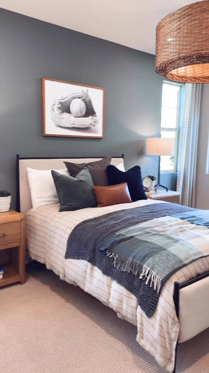Bedroom refresh 🙌🏻 

Using the Emery bed, a woven pendant light, baseball art, and layered bedding. 

Small nightstands with sturdy metal table lamps anchor the sides of the bed. 

Upholstered bed with black metal frame. Perfect for a guest room, kids room or master bedroom. 

Use code: MENDEZMANOR for 24% off curtains, blinds and shades from Two Pages! 

#LTKHome #LTKSaleAlert #boysbedroom

#LTKHome #LTKKids
