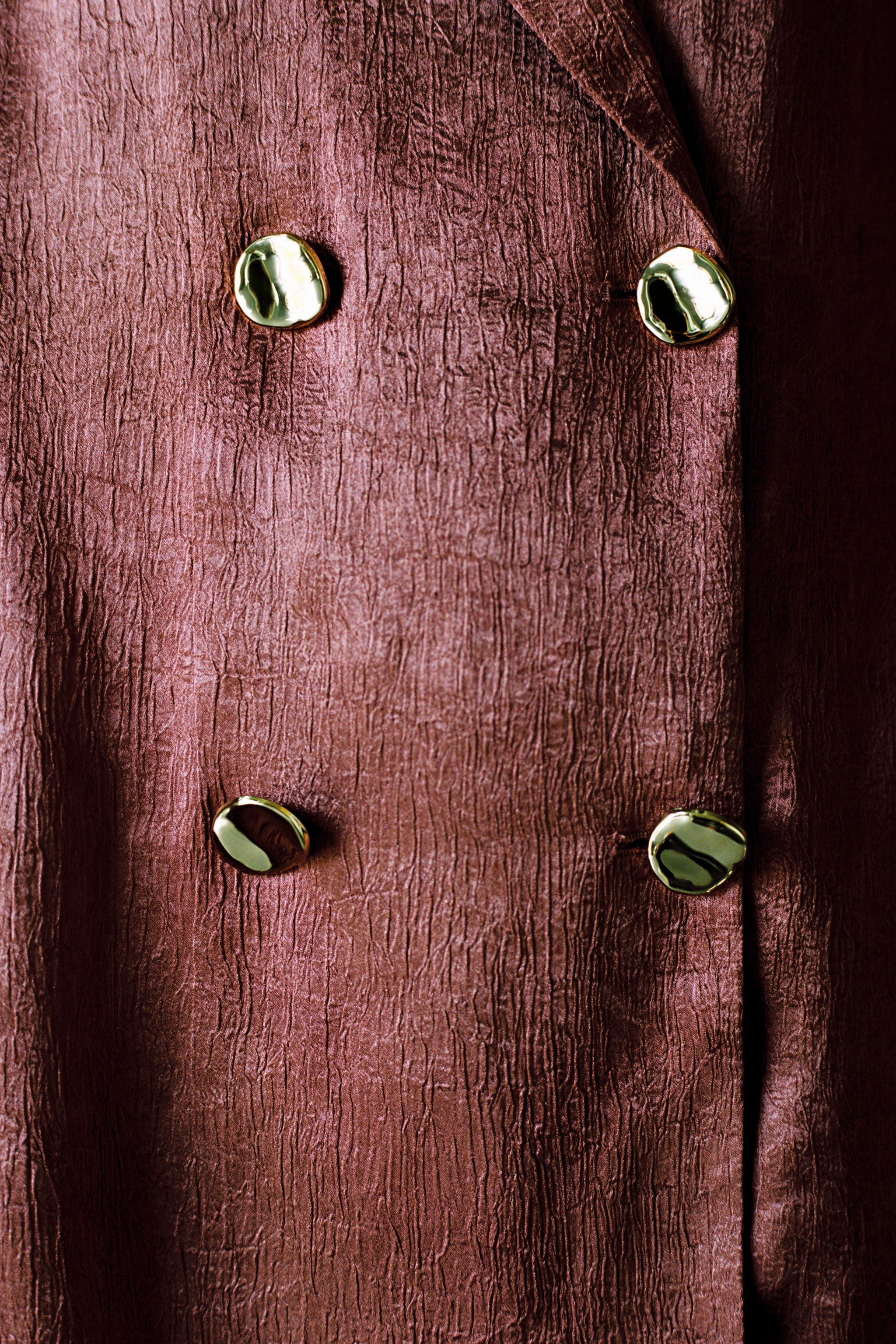 Long sleeve blazer with a lapel collar. Satin finish with a wrinkled effect. Hem with side vents.... | Zara US