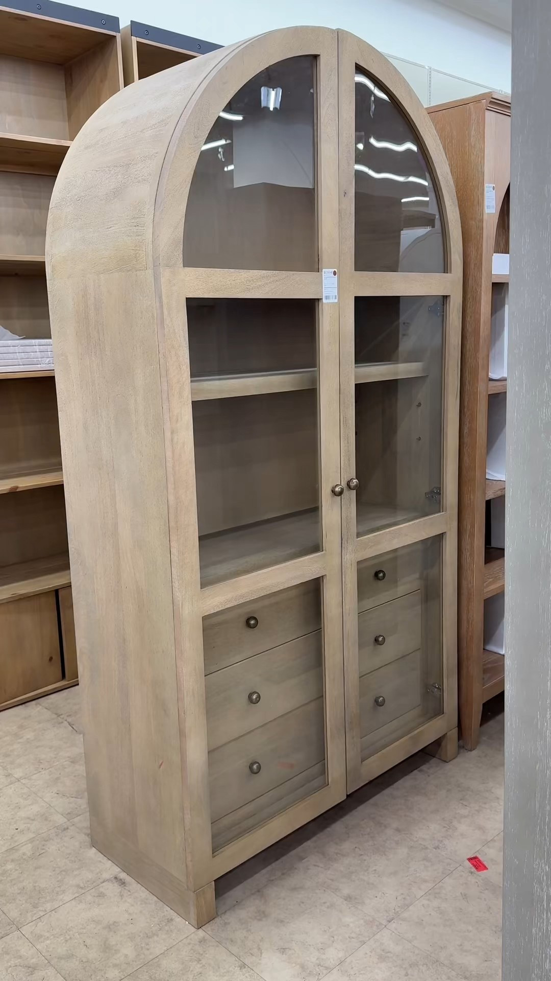 A closer look at the Stonewall 80” Curio Cabinet from Joss & Main on Wayfair — the storage is incredible! 🫶🏻 The adjustable shelves, deep drawers, and tall arched frame make it both functional and beautiful. The neutral mango wood finish and brass details give it that high-quality, timeless feel that instantly elevates a room. Such a stunning piece to organize, display, and style season after season. ✨ #ArchedCabinet #CurioCabinet #NeutralHomeDecor 

#LTKHome #LTKGiftGuide #LTKSaleAlert