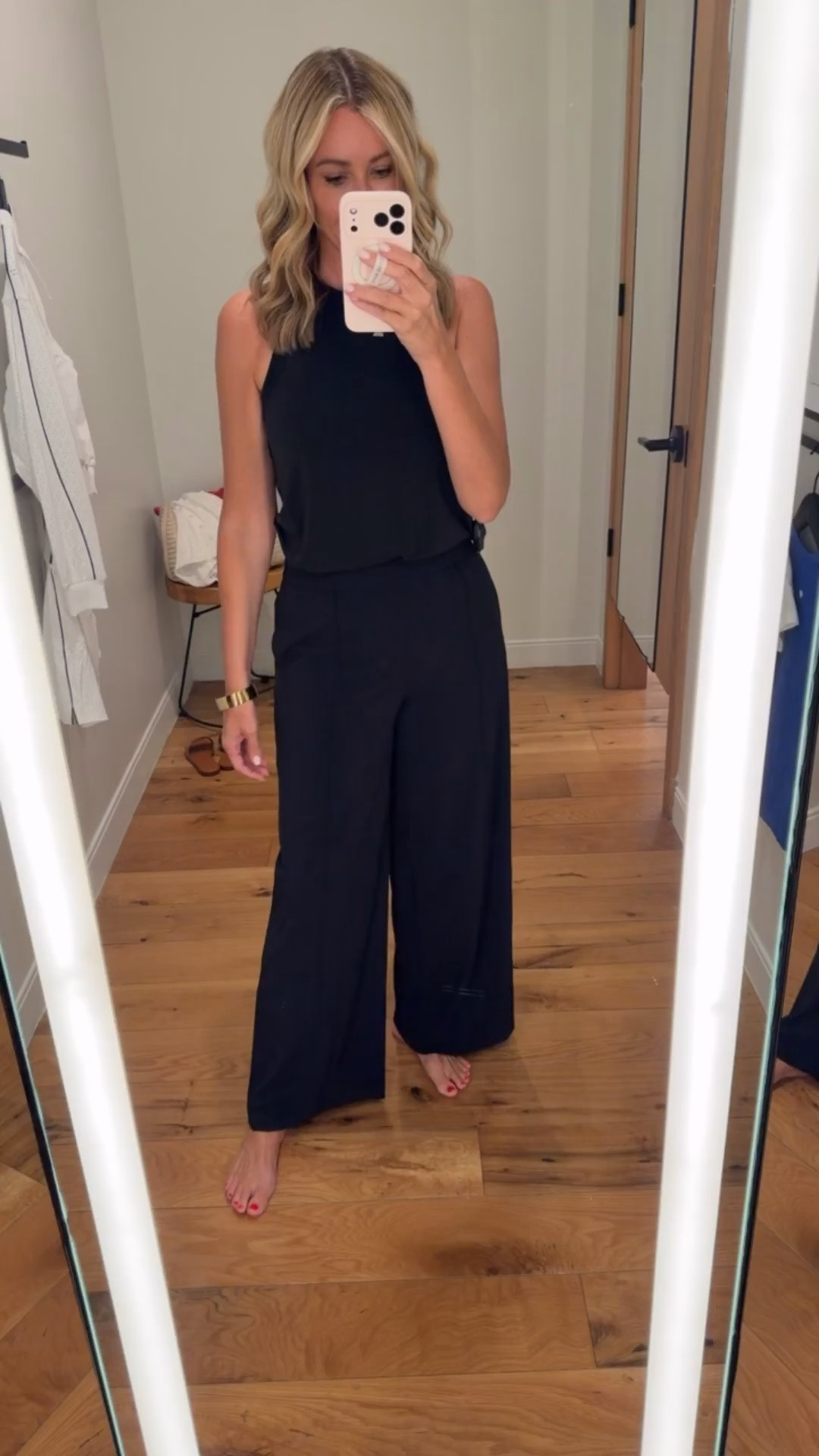 I packed this thinking it would be a great travel outfit, but it ended up being one of those pieces I wanted to keep wearing all day. The fabric is buttery soft with a beautiful drape, the wide leg pants move so well, and the sleeveless top gives it a clean, modern shape. It’s polished enough for dinner, comfortable enough for the flight home, and an easy outfit when you don’t want to overthink getting dressed.

Travel outfit, black matching set, wide leg pants, elevated basics, sleeveless top, comfortable outfit, airport style, capsule wardrobe, effortless style, HauteandHumid

#LTKootd #LTKActive #LTKOver40