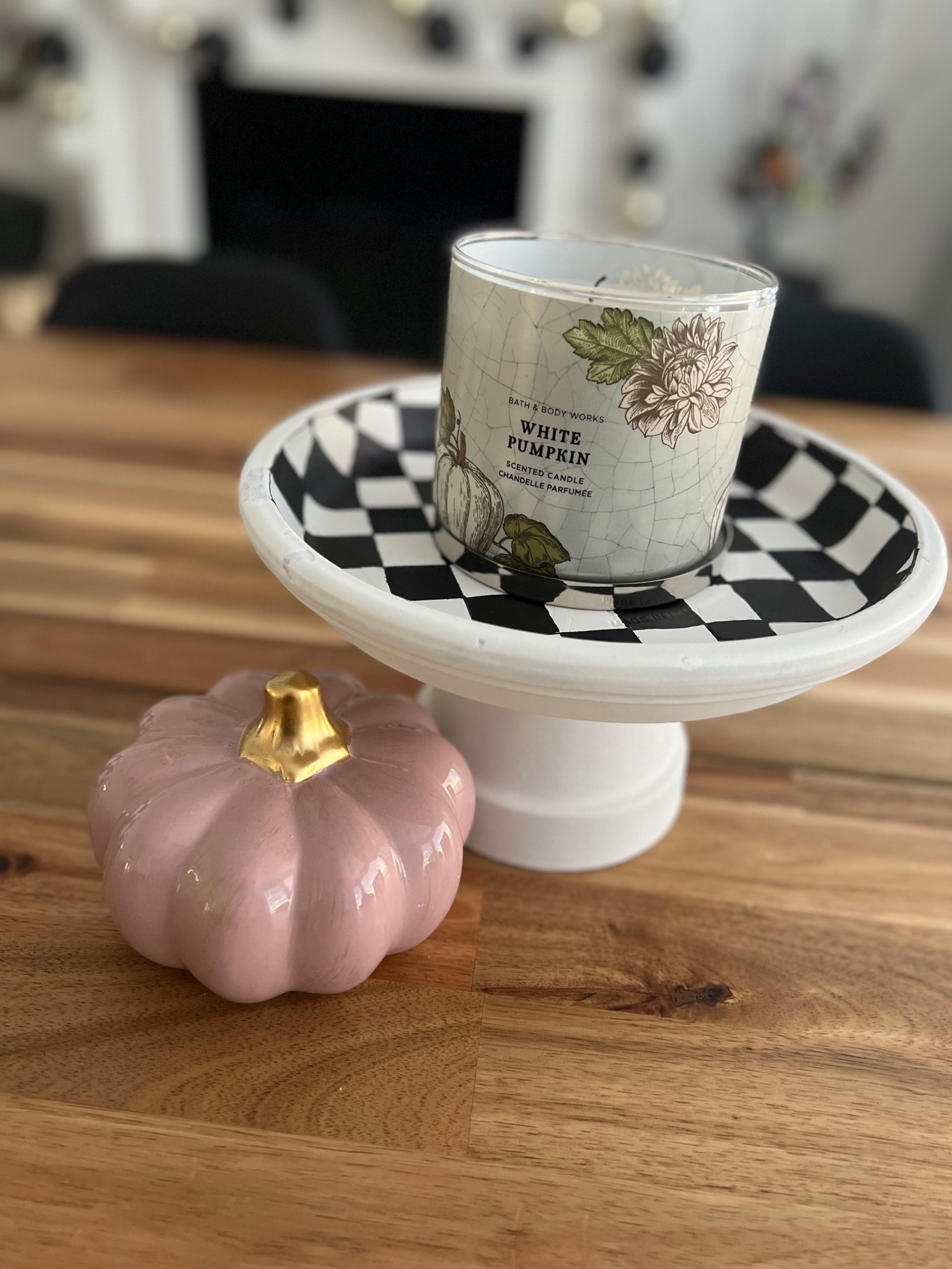 DIY fall decor, I made this set a couple years back. There is another larger tray that can sit under this one shown( as a tier tray) or separately (I had it on other end of the table here) and I painted a matching checkered pumpkin. I glued the bottom of an upside down terracotta pot to the underside of the terracotta saucer/tray, painted and the voila! The cutest DIY fall decor. Optional: seal with clear coat for protection. 

#LTKHome #LTKSeasonal #LTKFamily