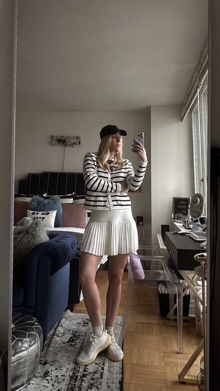 Tennis skirt outfit, striped cardigan, preppy style, game day outfit, baseball hat 

#LTKStyleTip #LTKActive