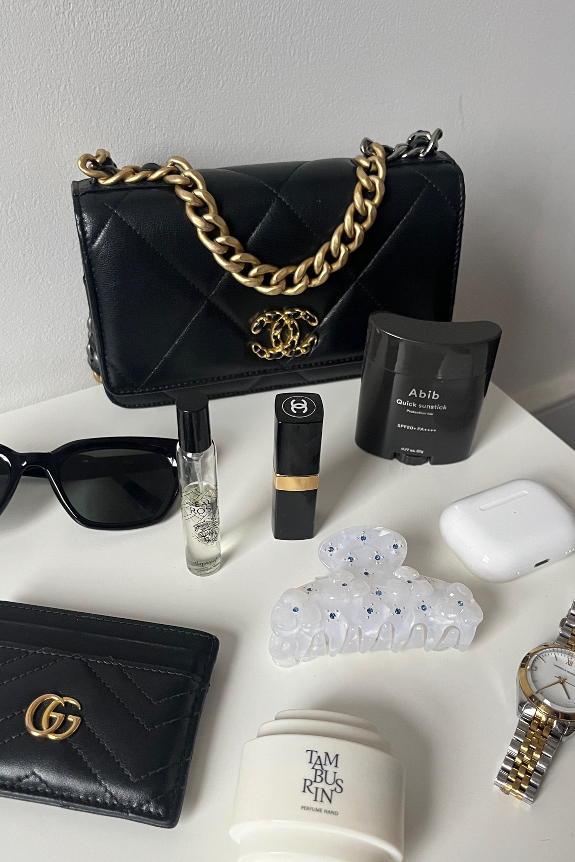 Daily essentials 🖤🤍

You can fit a lot of things in this Chanel 19 WOC, including card wallet, lipstick, perfume, airpods, sunstick, glasses, and watches! 

Links below for similar & exact items ✨

#LTKSeasonal #LTKsalealert #LTKGiftGuide