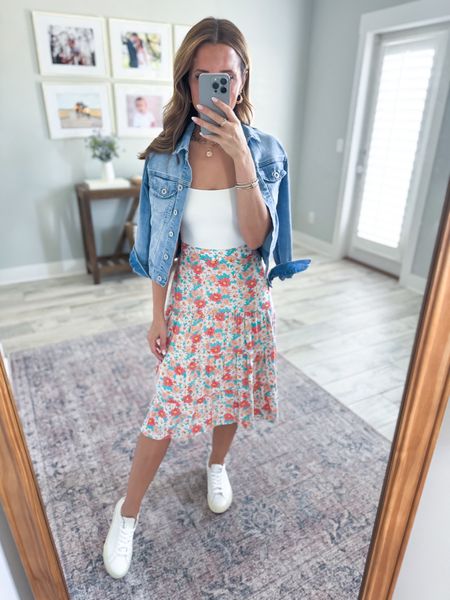 Amazon seamless tank tops in XS. Amazon skirt in small, the back is elastic, and I added a safety pin because it runs a little big on me. Spring outfit. Amazon denim jacket in XS, color Maude. Veja Esplar  sneakers, size down if you are half size. Favorite white sneakers. Code LISA10 on Cakes pasties!

#LTKfindsunder50 #LTKstyletip #LTKshoecrush