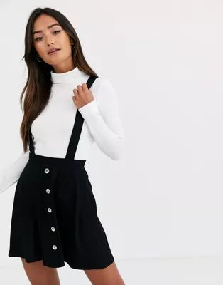 ASOS DESIGN button front mini pinafore skirt in black | ASOS (Global)