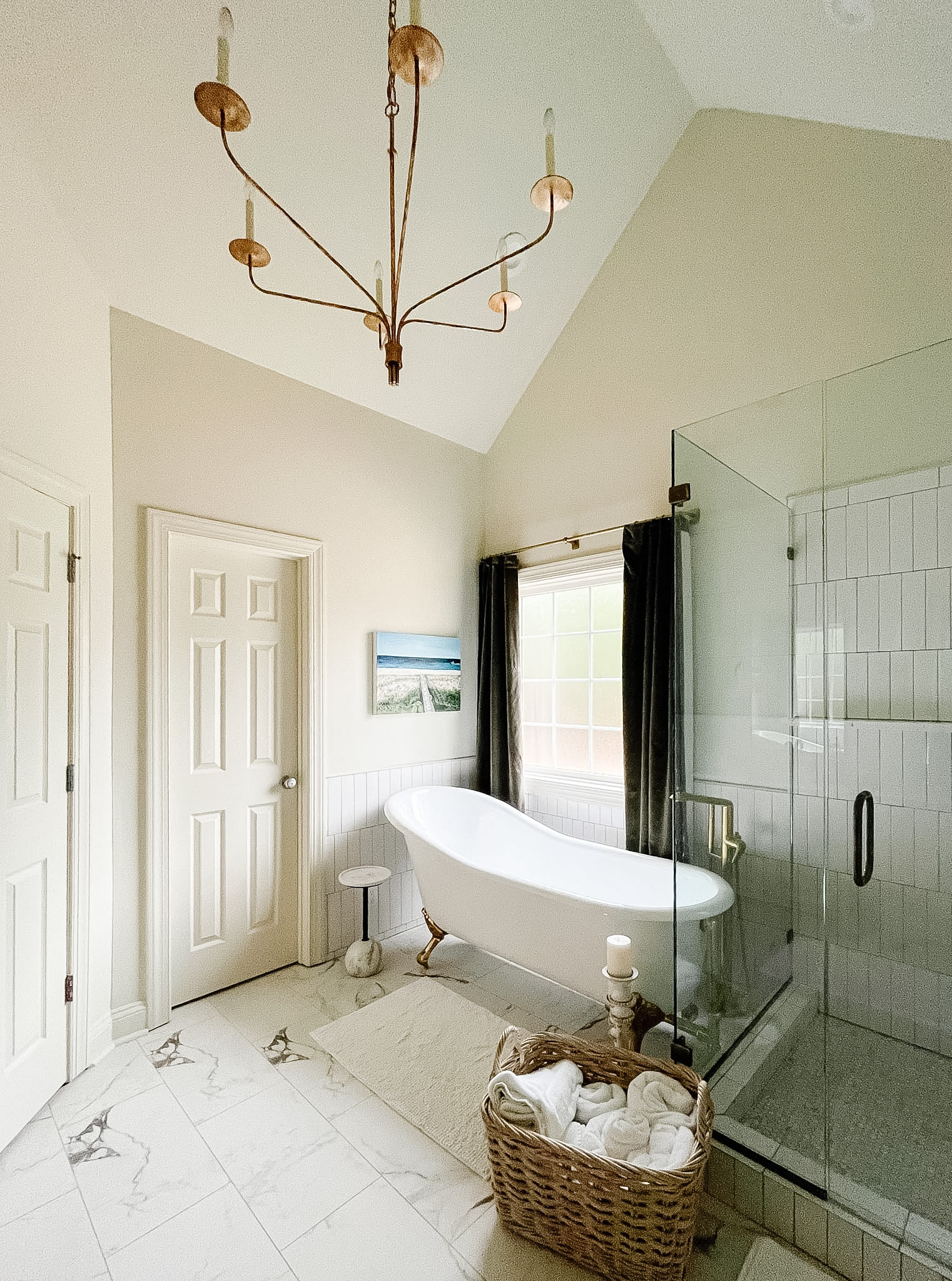 A bathroom designed to feel like a retreat ✨ The freestanding clawfoot tub creates a timeless focal point, while rich velvet curtains add an unexpected layer of softness and drama. Brushed brass fixtures, marble accents, and warm lighting complete the look, turning this once-ordinary bathroom into a space that feels indulgent and relaxing. Shop a similar look below. 🛁💫

#ltkhome #bathroomdesign #primarybathroom #clawfoottub #traditionaldesign #timelessinteriors #interiorinspo #luxurybathroom #bathroominspiration #brassfixtures #marblebathroom #classicinteriors 

 #LTKHome