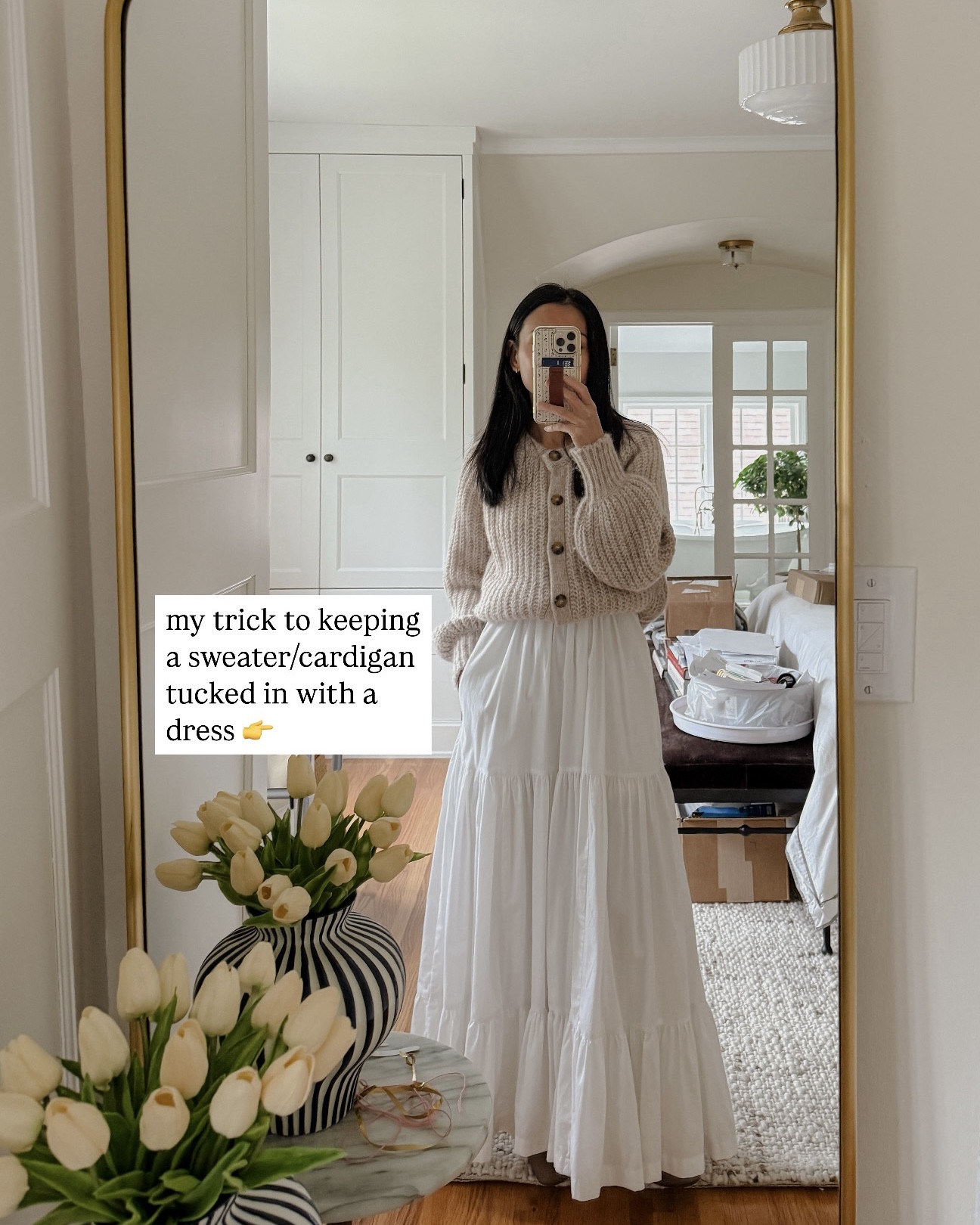 dinner outfit. dress is an oldie but linking another white dress. i wore my cardigan buttoned up over a dress and have it looked tucked in by using an old stretchy headband (just saw after i posted that “band” was autocorrected to “back” 😅) 👌. They also sell waistbands for this! Also, if you don’t want to tuck your bulky sweater into your jeans/pants, you can you use a waistband 🙌

#LTKStyleTip #LTKPetite