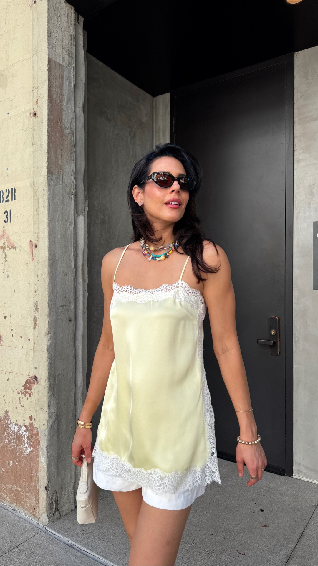 The kind of outfit I’ll be wearing on repeat all summer.

Whether it’s a day in the city, a European getaway, or lunch with friends, this combination never fails. This satin cami with delicate lace detailing feels so elevated and feminine, and the butter yellow color instantly puts me in a good mood. The best part? It’s currently part of the Aritzia Private Summer Sale for under $100 and comes in multiple colors.

Paired with a great pair of white linen shorts (a true summer wardrobe staple), mesh sandals, and a statement necklace, it’s one of those effortless outfits that always looks polished. My sandals are from a previous season, but I found similar options for you. And these earrings? A birthday gift to myself last summer that I still wear constantly. If you've had your eye on them, they're currently available through Vivrelle's membership program.

Use my code DIANACAROLINA for 1 month free at Vivrelle. 

 #LTKootd #LTKSaleAlert #LTKTravel