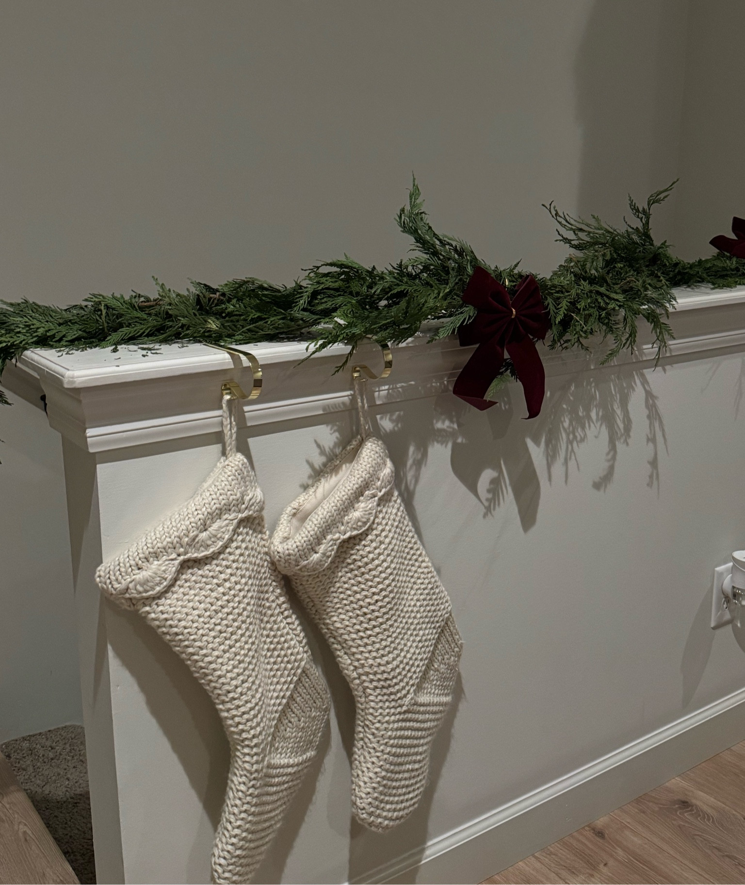 Cozy holiday decor🤍 garland is from Costco & the bows are thrifted! 

#LTKHome #LTKHoliday #LTKFindsUnder50