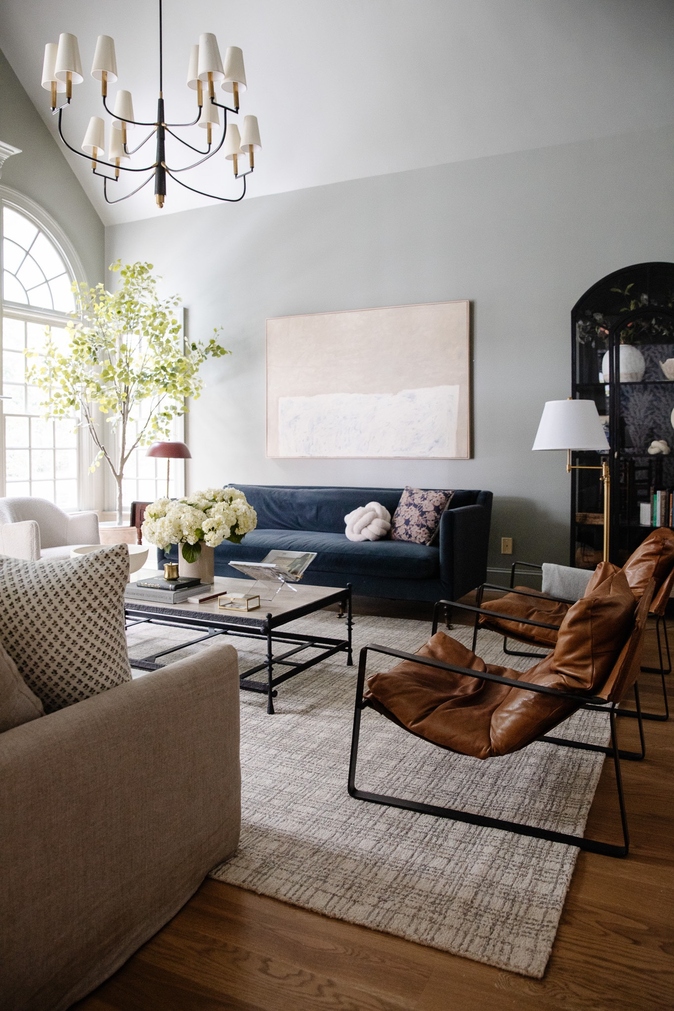 Ever wonder how to introduce different fabrics into a room? Sharing all my tips on ChrisLovesJulia.com

Living room, leather sling back chairs, rug, coffee table, linen couch, velvet couch, floor lamp, table lamp, curio cabinet, faux tree, chandelier, acrylic book stand, coffee table books

#LTKstyletip #LTKfamily #LTKhome
