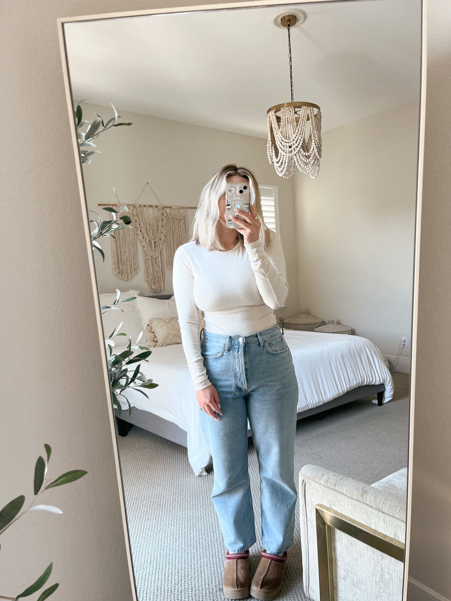 my top the slinky rib shirt from nuuds- it fits true to size! linked my wide leg jeans and tazz uggs! i’m 5’3 and wearing the cropped jeans- i recommend sizing DOWN because they do stretch out a lot after a month or so of wear! 

#wearingvsstyling #fallootd #uggseason 



#LTKHoliday #LTKfindsunder100 #LTKGiftGuide