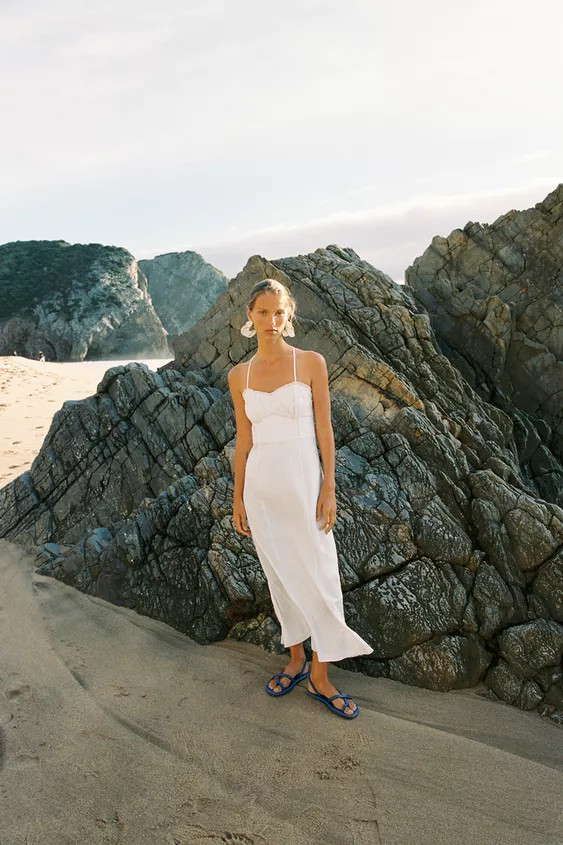 Dress made with linen. Straight, fitted neckline with ruching and lace trim. Thin straps. Tonal l... | Zara UK