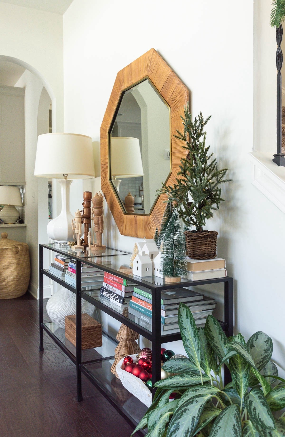 I like to get creative with different ways and locales and surfaces to showcase some of my Christmas collections, like these natural wood nutcrackers, mini village houses and small Christmas trees of several different types. My living room console table is ideal for styling during the holiday season. home decor living room decor Christmas decor rattan Christmas tree pre-lit pine tree natural nutcracker traditional Christmas large round vase

#LTKHoliday #LTKHome #LTKFindsUnder50