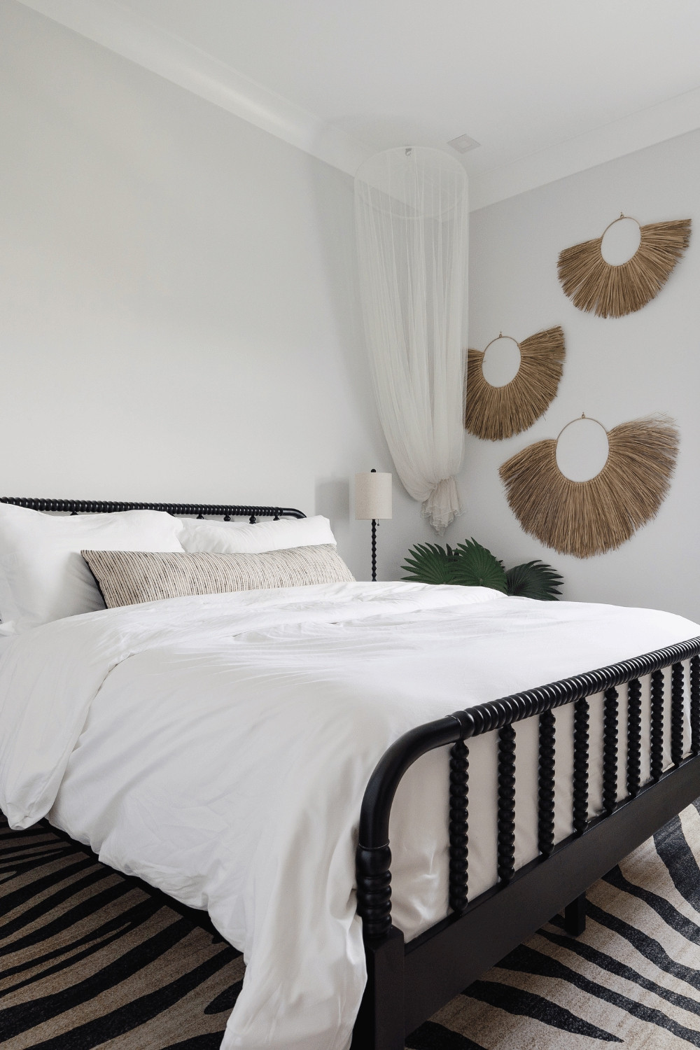 Remember how popular mosquito nets used to be?  I totally had one over my bed in HS.  I like the little touch of whimsy it adds to the corner of this safari-themed room in the beach house VRBO.

#beachhouse #homedecor #tropical  

 #LTKHome