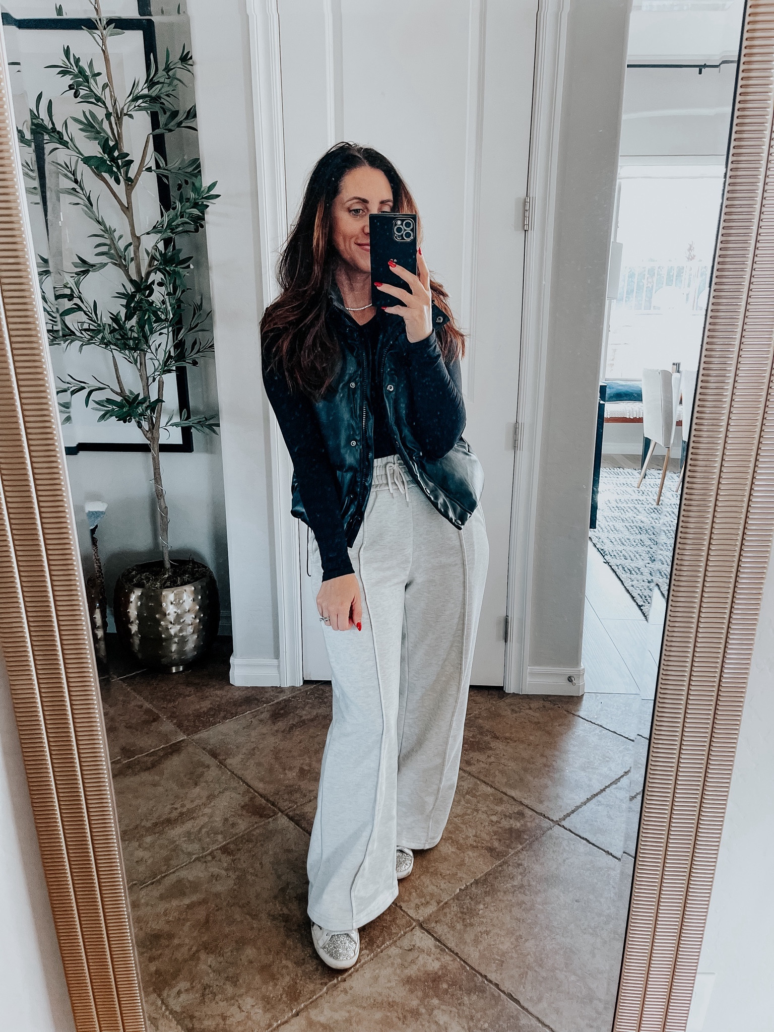 Casual winter outfit idea 🖤 // wide leg lounge pants with black tee & faux leather vest with sneakers // casual winter style, winter outfit inspo 
Amazon fashion 
Wide leg sweat pants 

#LTKstyletip #LTKsalealert #LTKfindsunder50