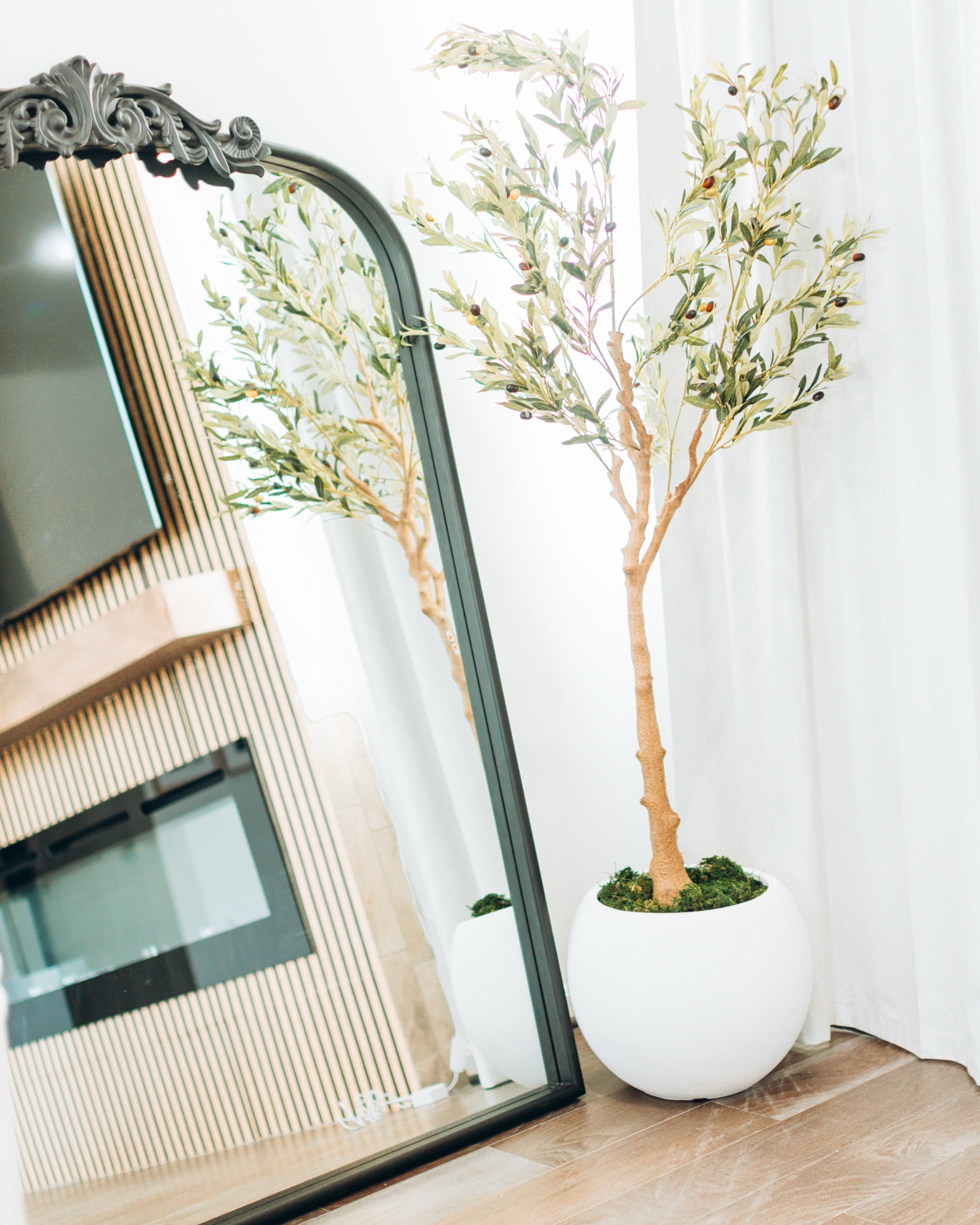 How I transformed my living room with this Faux Olive Tree and Mirror from Hobby Lobby #fauxtree #olivetree #fauxolive. Makes a difference in your room and space #homedecor

#LTKHome #LTKFamily