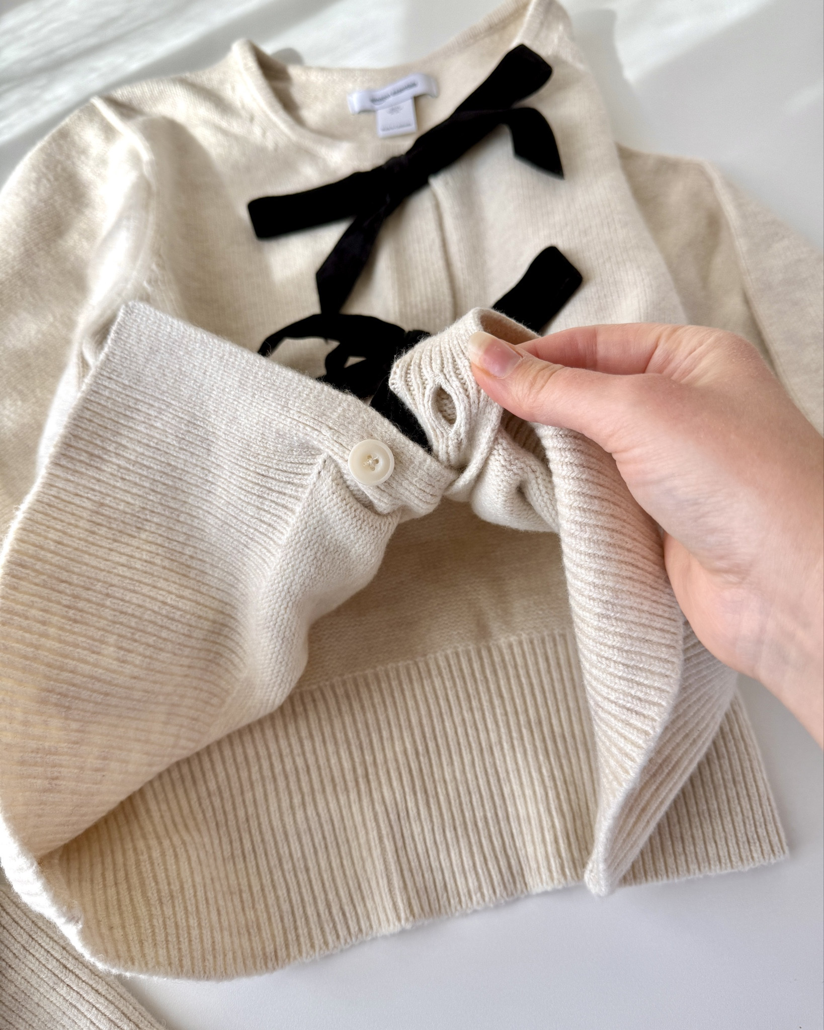 🥰 The Demi Lovato collect does not disappoint!! 😍
This bow tie cardigan is amazing!! 🎀 

Honestly this is my favorite clothing purchase in a while. It’s soft, not thin or flimsy feeling, stylish (I love the bow trend), and makes me feel festive and cute! The fabric is higher quality than I was expecting. 
🔅There are buttons inside that can be undone and the velvet ribbon is sewn on each side - so you could unbutton and then untie the bows if you wanted the cardigan open. I plan to keep it buttoned and nicely tied exactly as it came 🖤🍦

#LTKFindsUnder50 #LTKFindsUnder100 #LTKSaleAlert